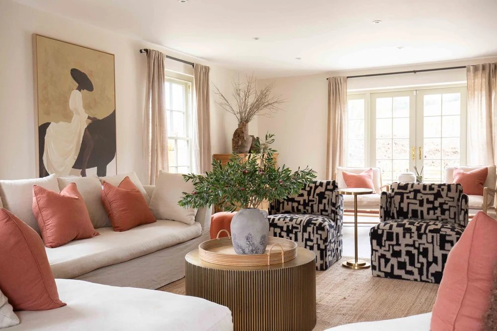 Cosy evenings start here.

The living space at Willowbrook House is all about warmth, comfort and togetherness. A striking Cotswold stone fireplace with a double-sided wood burner sits at the heart of the room, heating both the main lounge and the sn