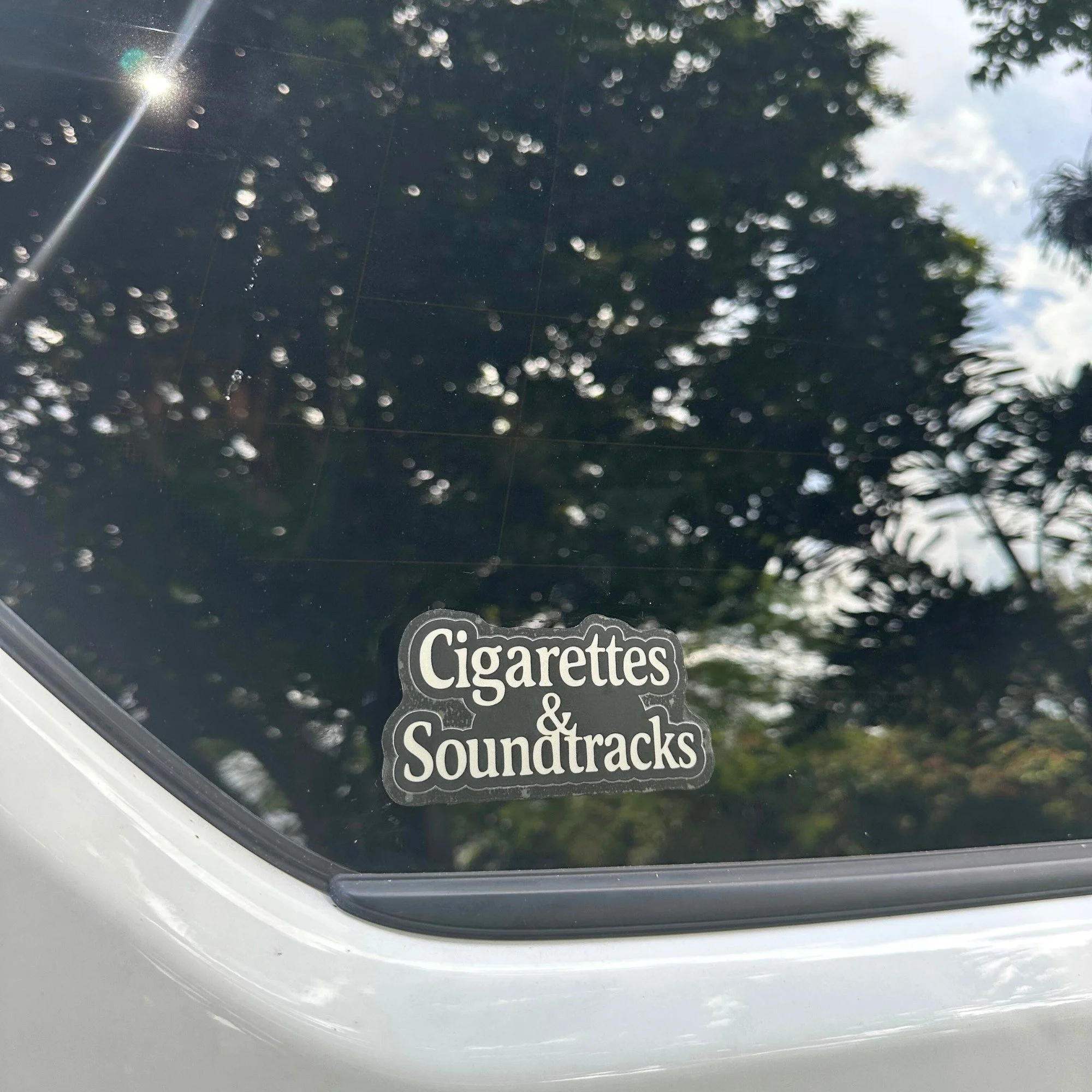 Cigarettes and soundtracks vinyl car sticker with vintage style typography