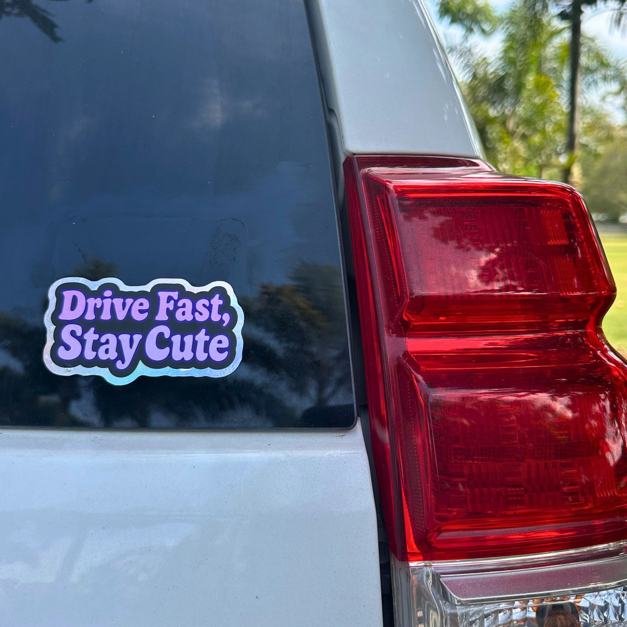 Drive fast stay cute pink vinyl car sticker with bubbly lettering
