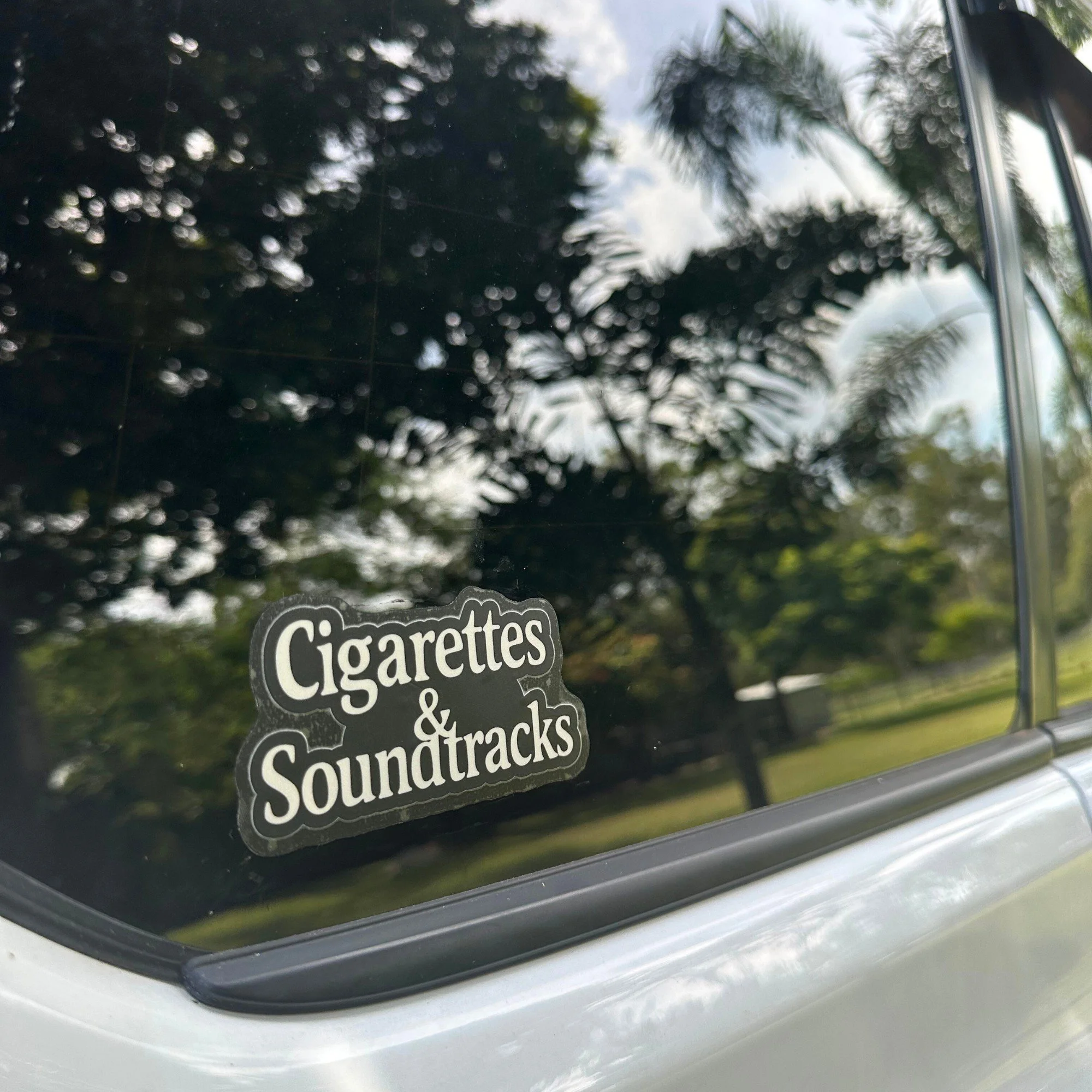 Cigarettes and soundtracks vinyl car sticker with vintage style typography