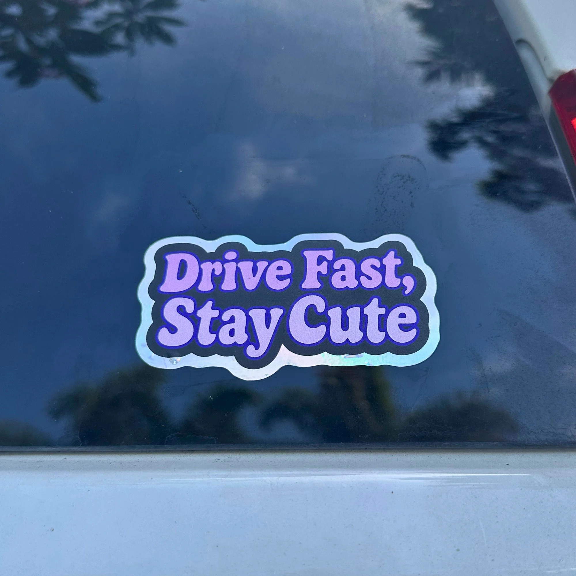 Drive fast stay cute pink vinyl car sticker with bubbly lettering