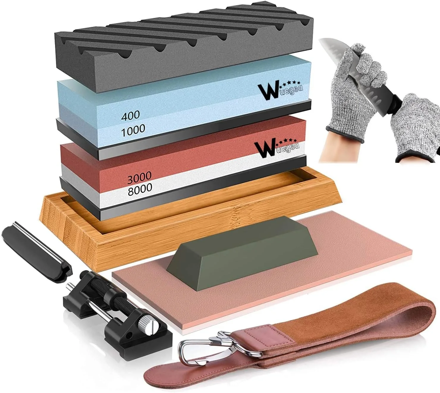 A collection of sharpening stones, a honing guide, a leather strop, and gloves used for sharpening and maintaining knives and tools.