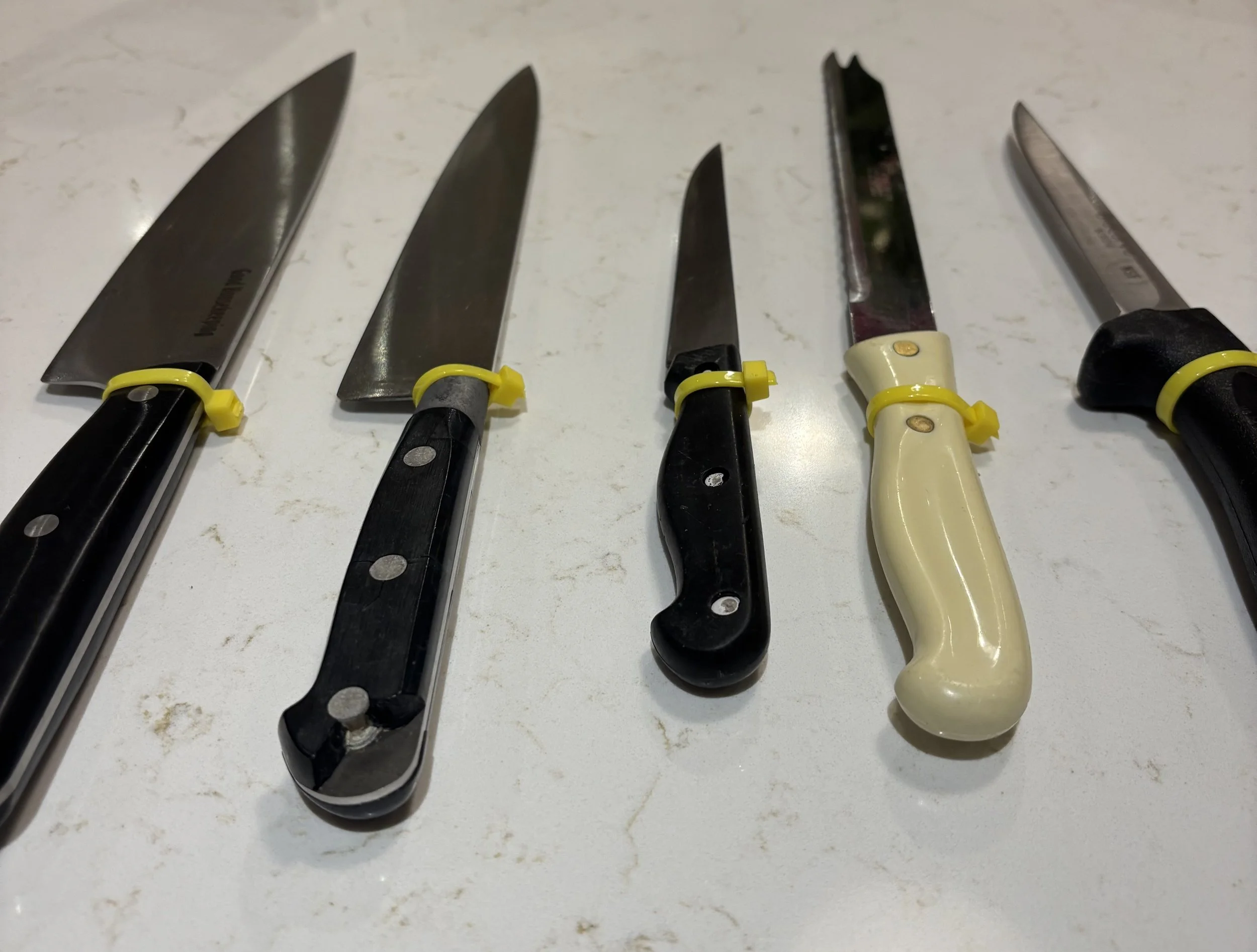 Sharpened Knives. Each sharp knife marked with a zip tie