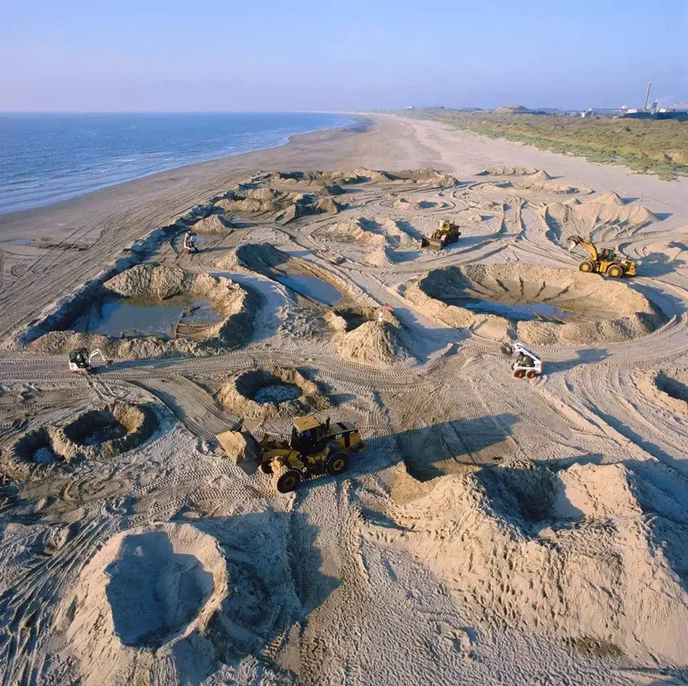 First woman on the moon by aleksandra mir is a moon landscape, land art and performance art on a dutch beach created in 1999 by casco projects in Utrecht. It is widely considered a prime example of feminist art tradition which celebrates womens art