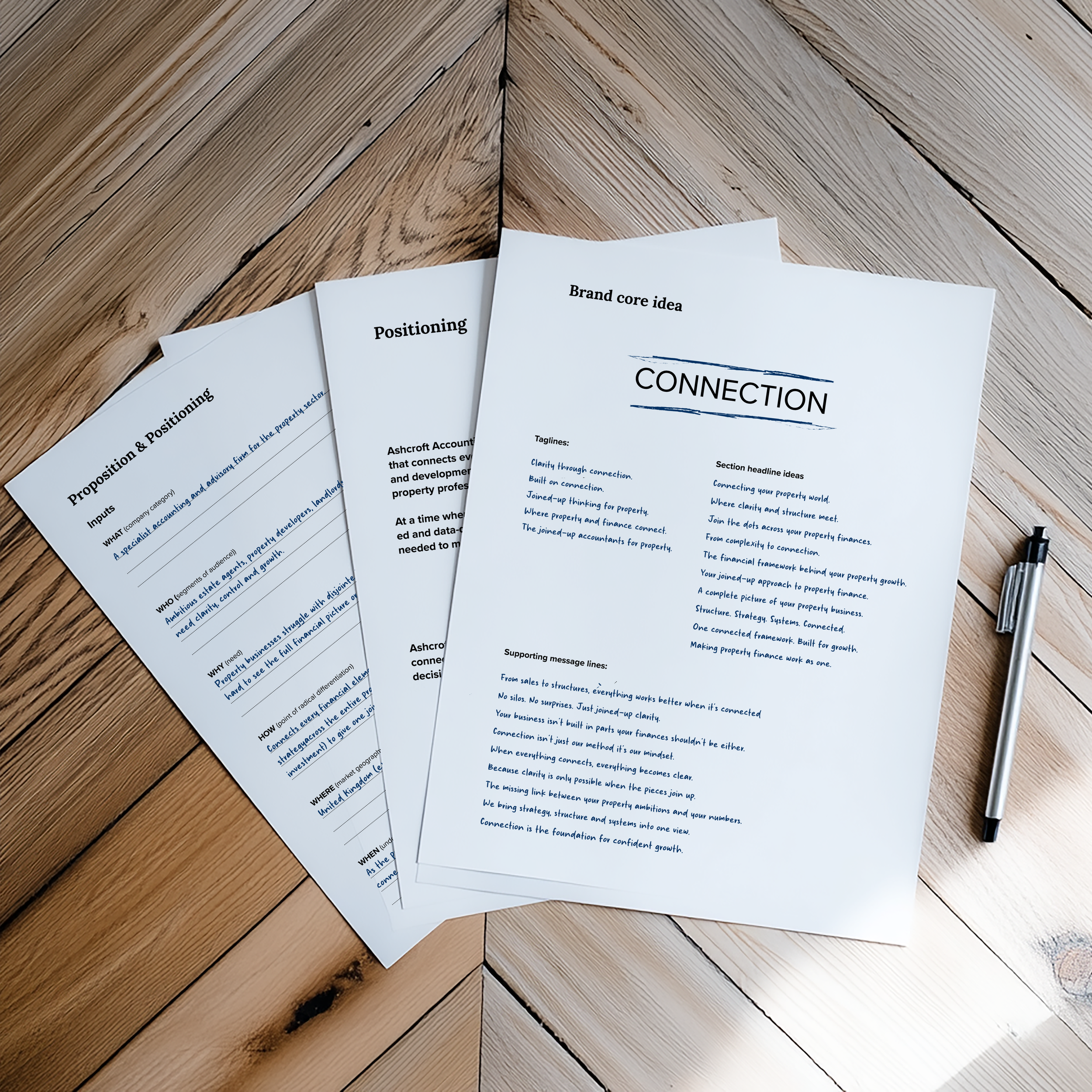 Study materials on connection and brand core positioning ideas, including printed documents with text and a black pen placed on a wooden surface.