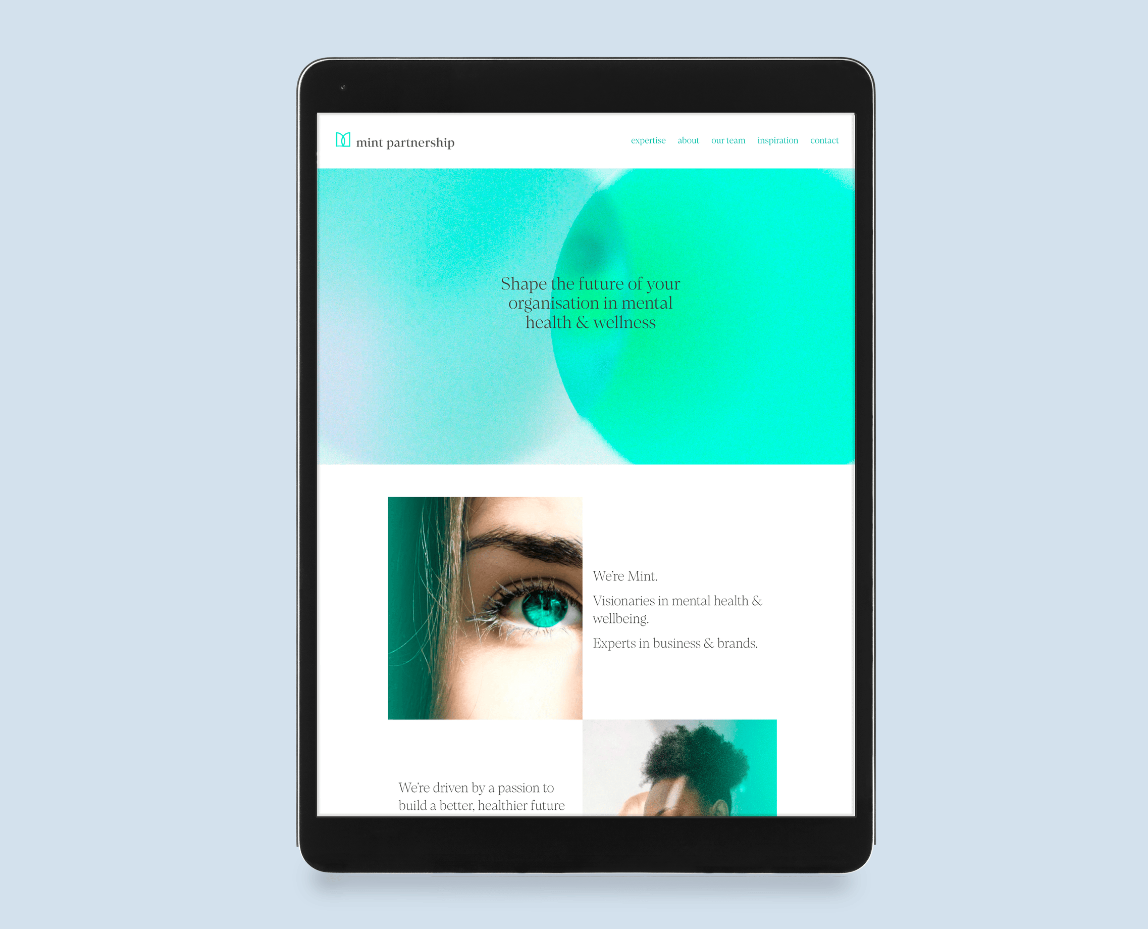 Tablet displaying a website for Mint Partnership, with a light blue background and images related to mental health and wellness.