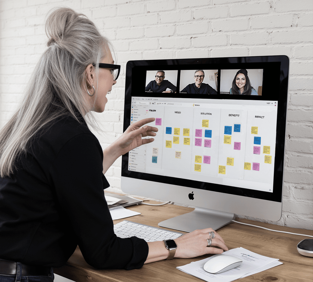 Woman participating in a video workshop helping her website clients with their messaging and brand strategy. There are columns labeled 'Problem,' 'Need,' 'Solution,' 'Benefit,' and 'Impact.'