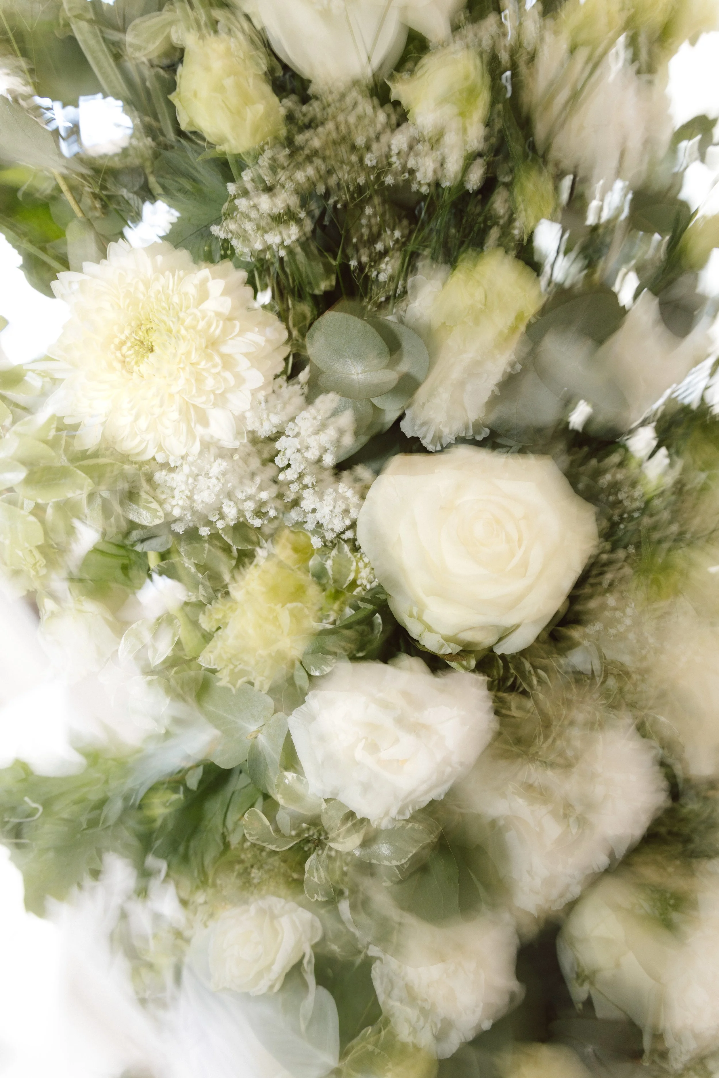 Close up of green and white wedding flowers, motion blur.