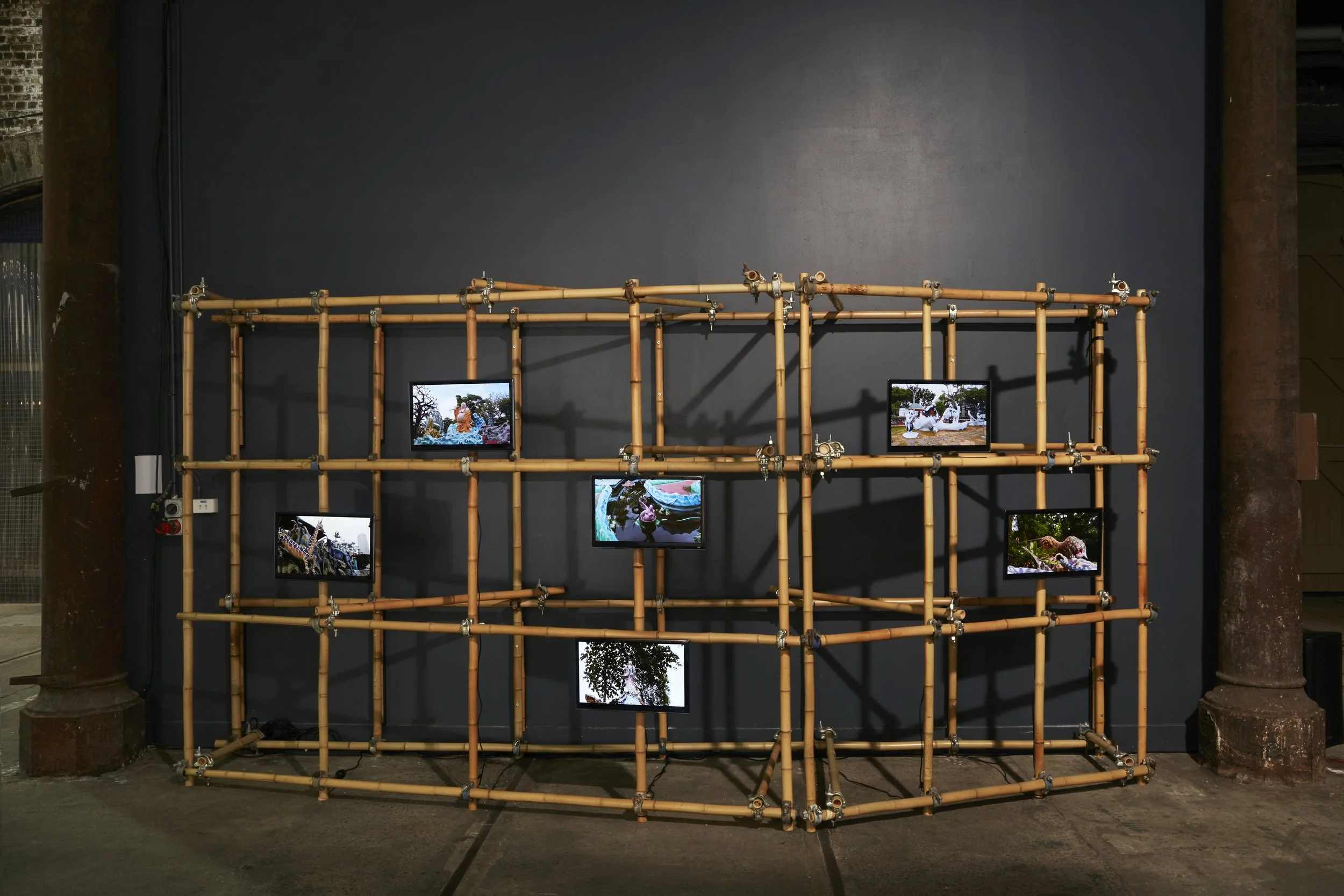 Haw Par Villa – Video Snapshots series, 2016-2019, single channel video, screens, bamboo, metal scaffolding clamps, 240 x 465 x 70cm 