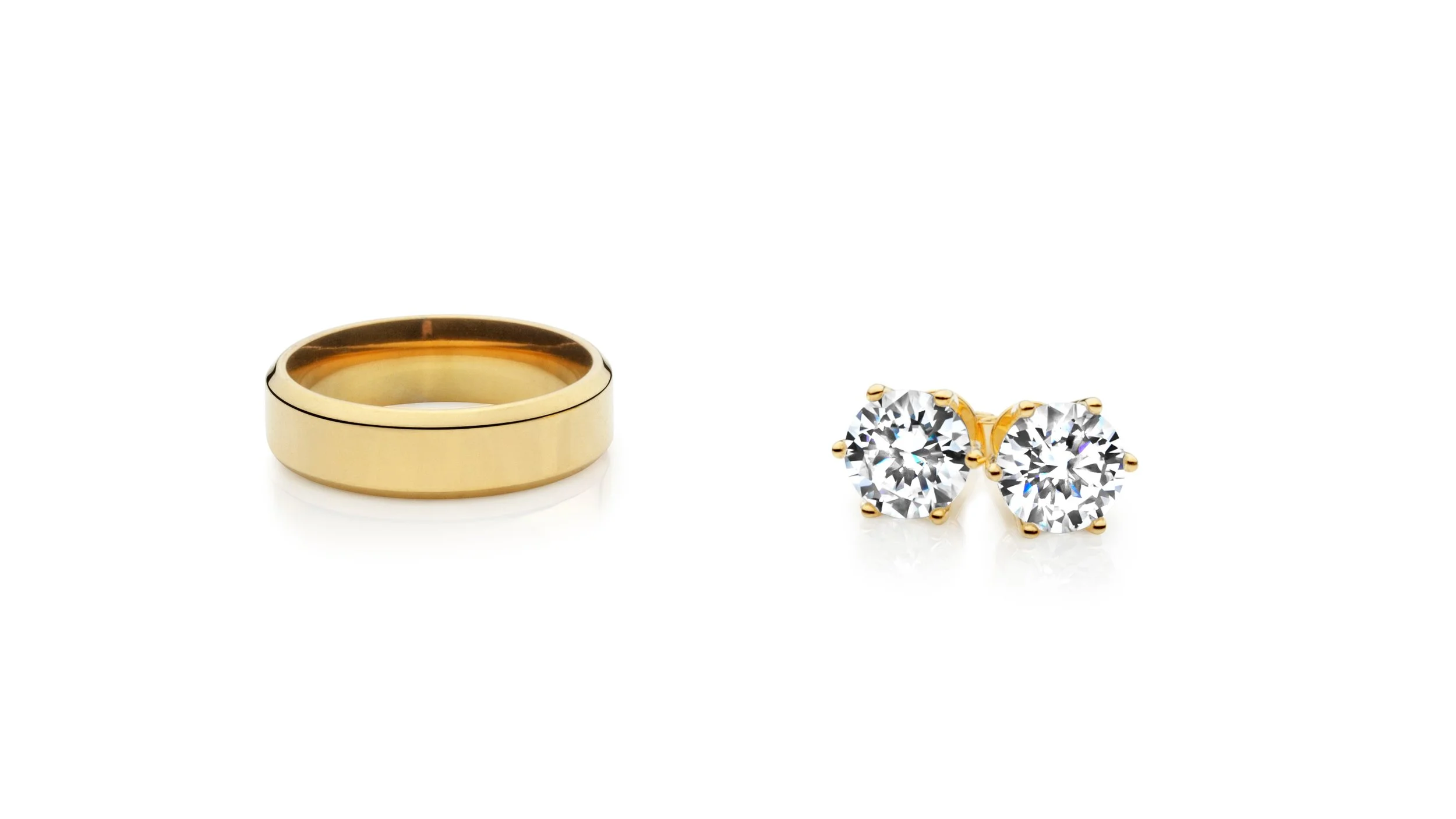 Professional jewelry picture of a gold ring and a pair of gold stud earrings with large, round diamonds on a white background.