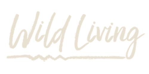 Wild Living text in a stylish handwritten font on a black background.