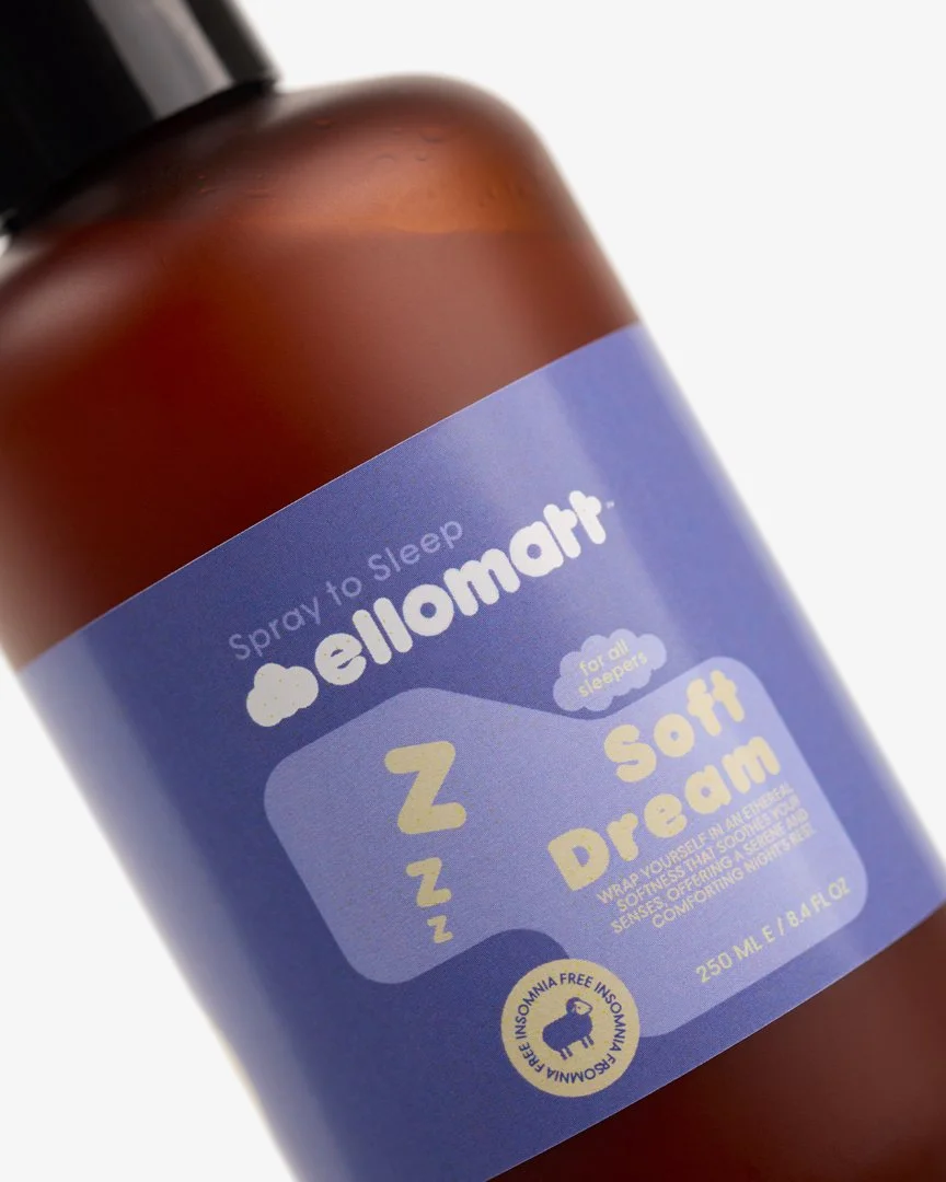 A bottle labeled 'HelloMello' with the text 'Spray to Sleep,' 'for all sleepers,' and 'Z Z Z Soft Dream' on a purple label, designed for insomnia relief.