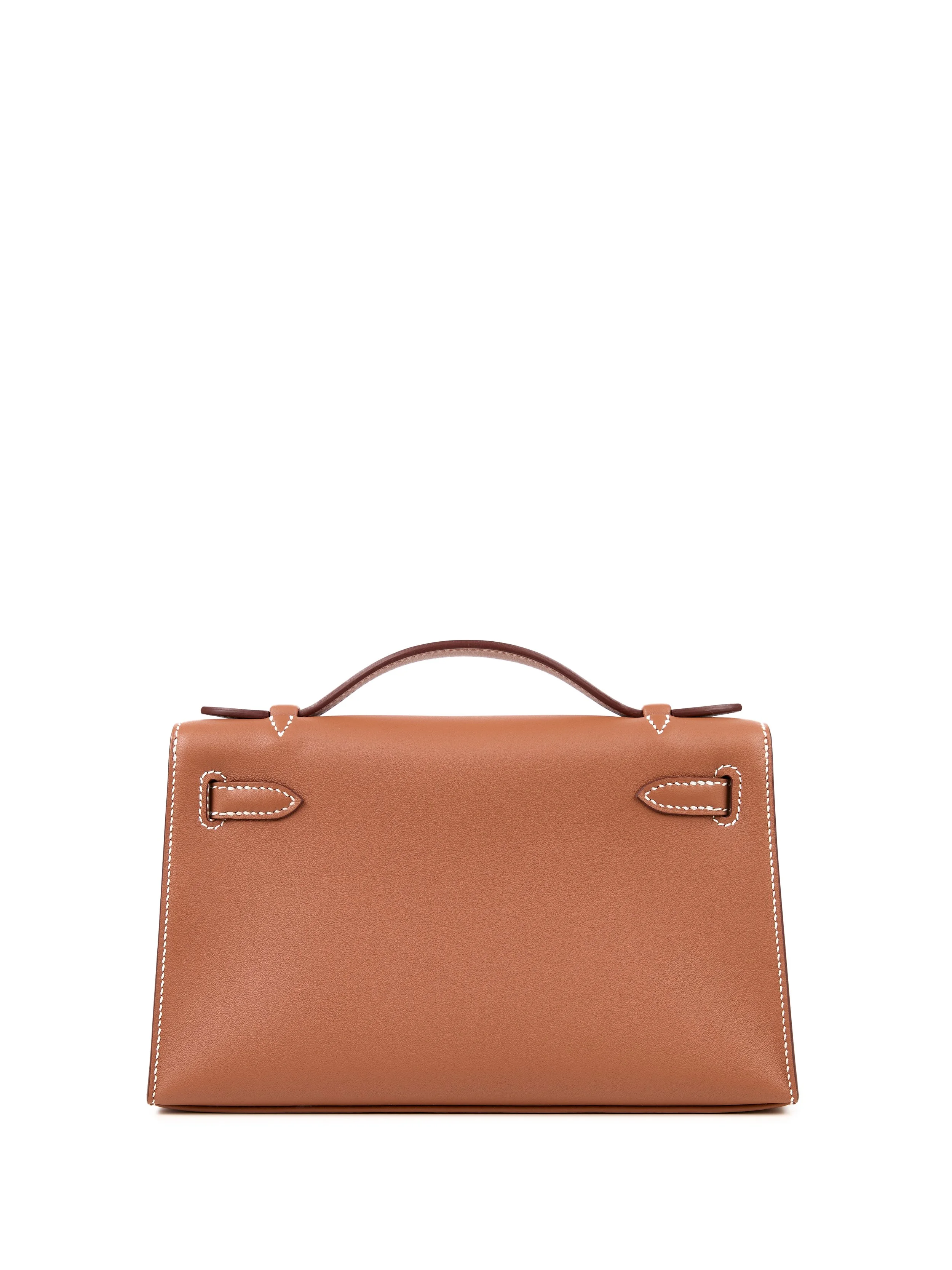 Tan handbag with brown handle and white stitching on a white background.
