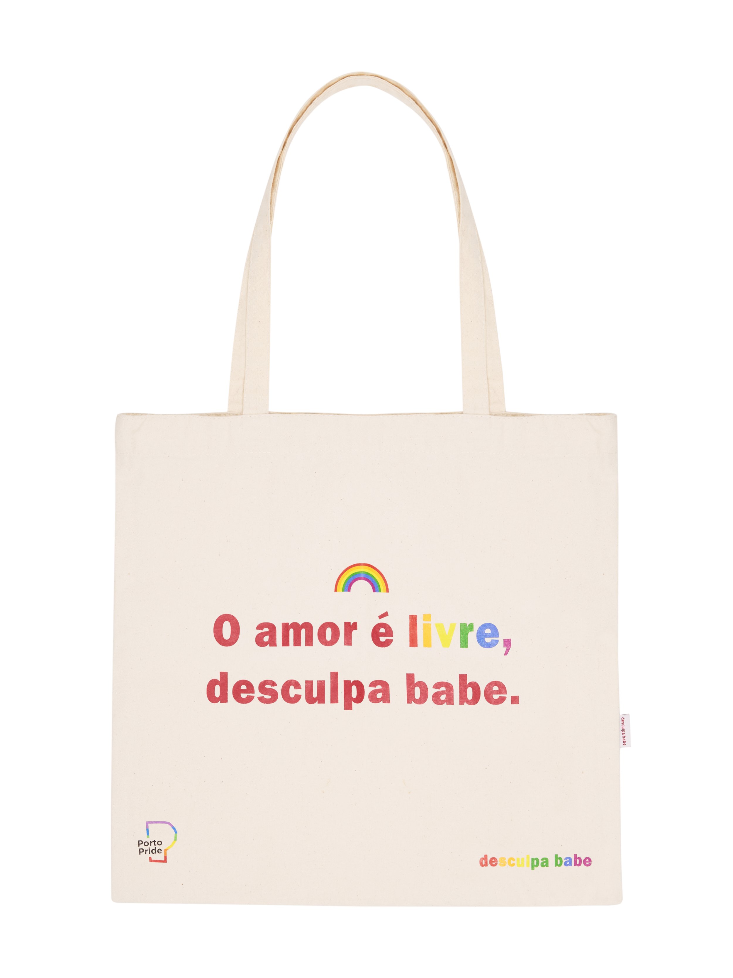 A white tote bag with text and colorful rainbow graphics. The text says 'O amor é livre, desculpa babe.' with 'livre' and 'babe' in rainbow colors. There is a small rainbow image above the text and 'Porto Pride' logo in the bottom left corner.
