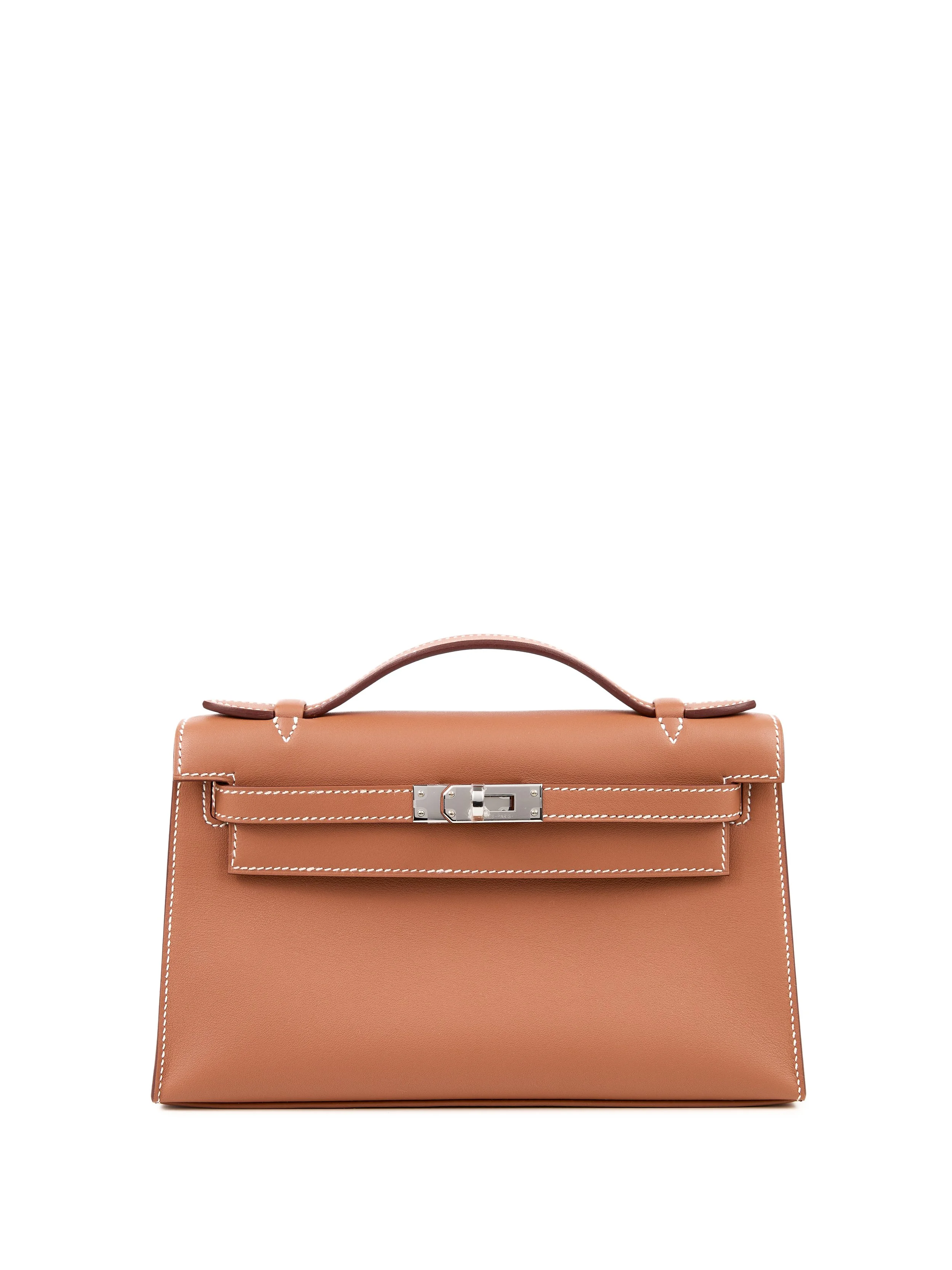 A tan Hermès Kelly bag with white stitching and a silver turn lock closure on a white background.