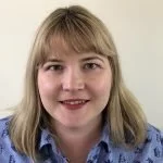 Home-Start Coordinator, A woman with shoulder-length blonde hair wearing a blue shirt, smiling at the camera.