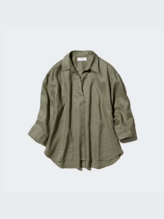 Olive green long-sleeve button-up shirt with a collar, laid flat on a plain surface.