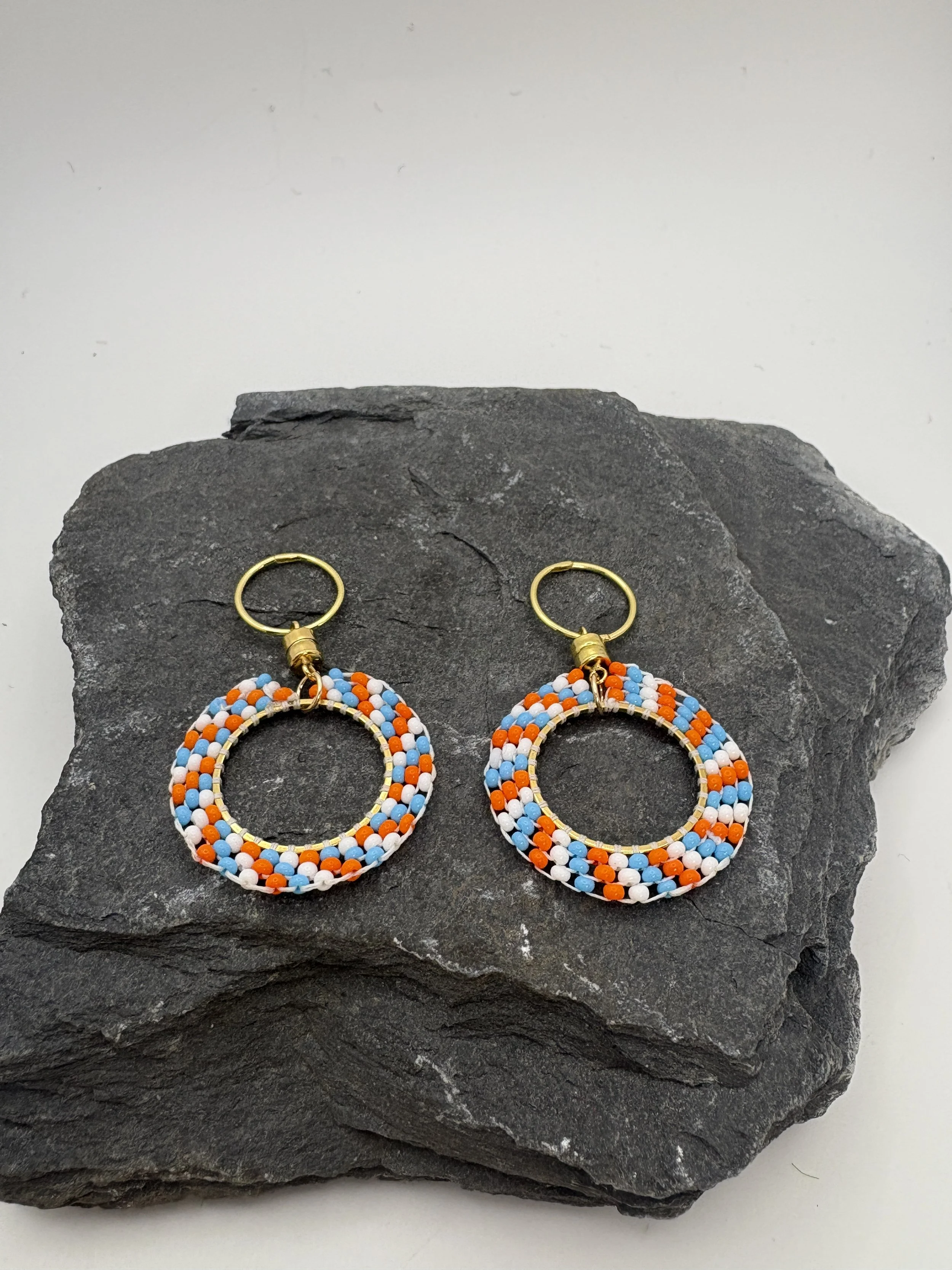 Small circle spiralled beads in Aqua, Orange and white