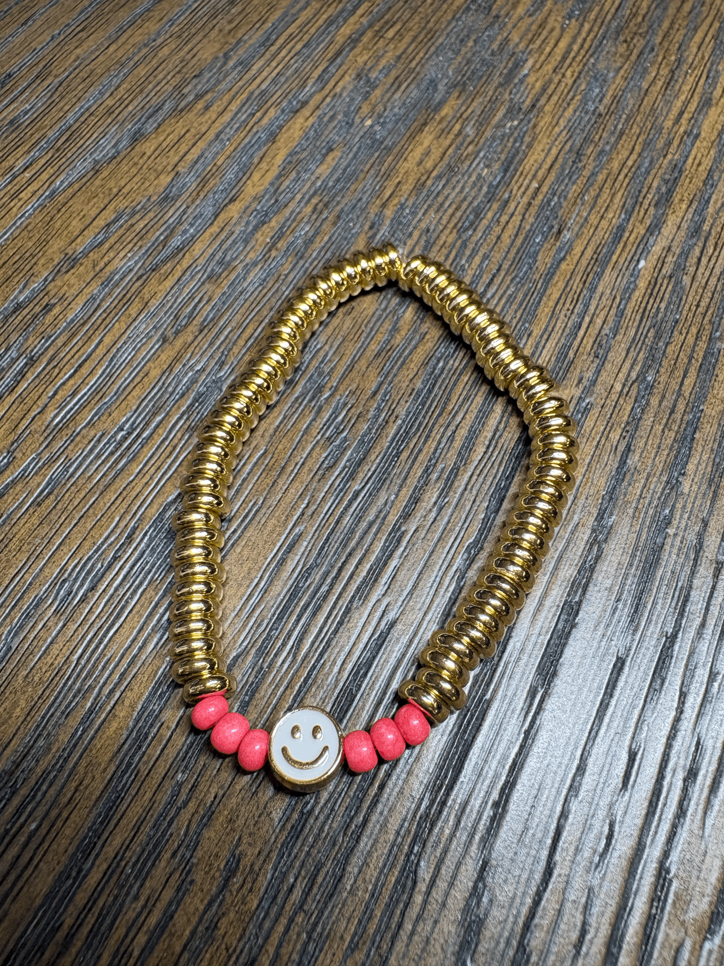 Gold sweetie bracelet with coral beads