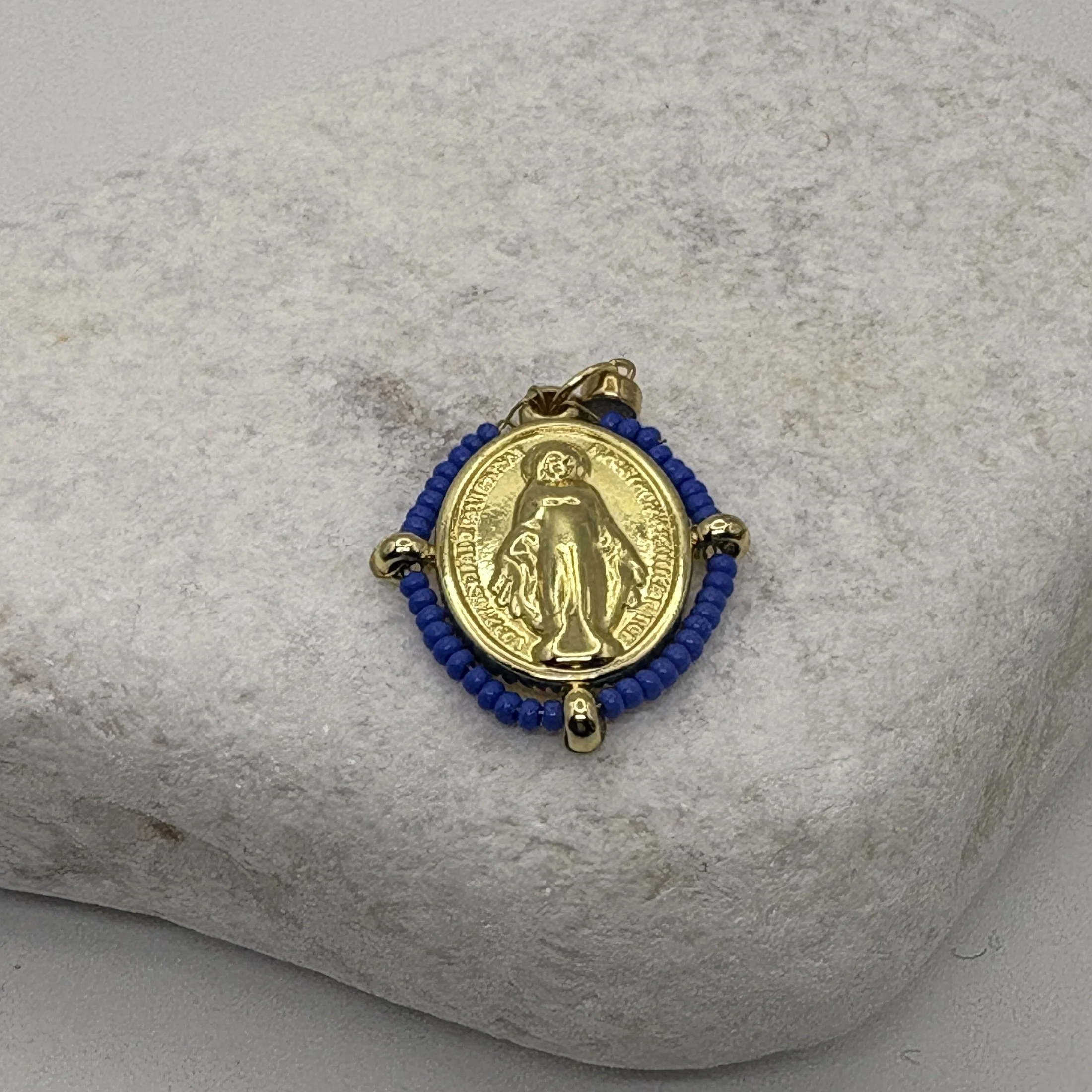 Oval 18K gold plated Virgin Mary charm with a pale blue bead surround