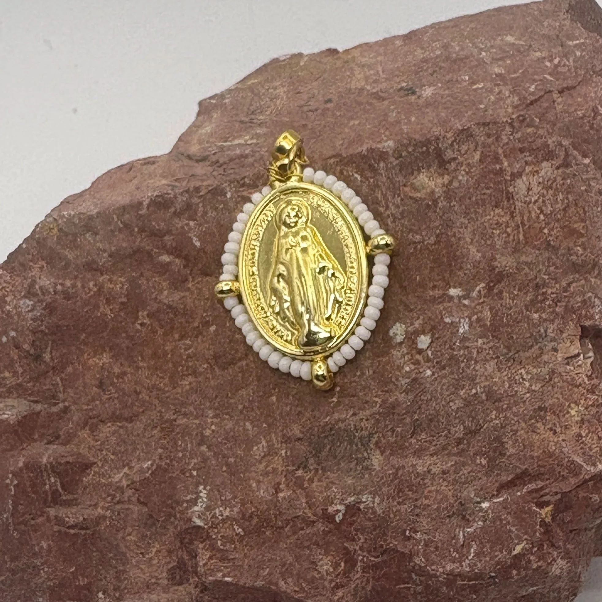 Oval 18K gold plated Virgin Mary charm with a white bead surround