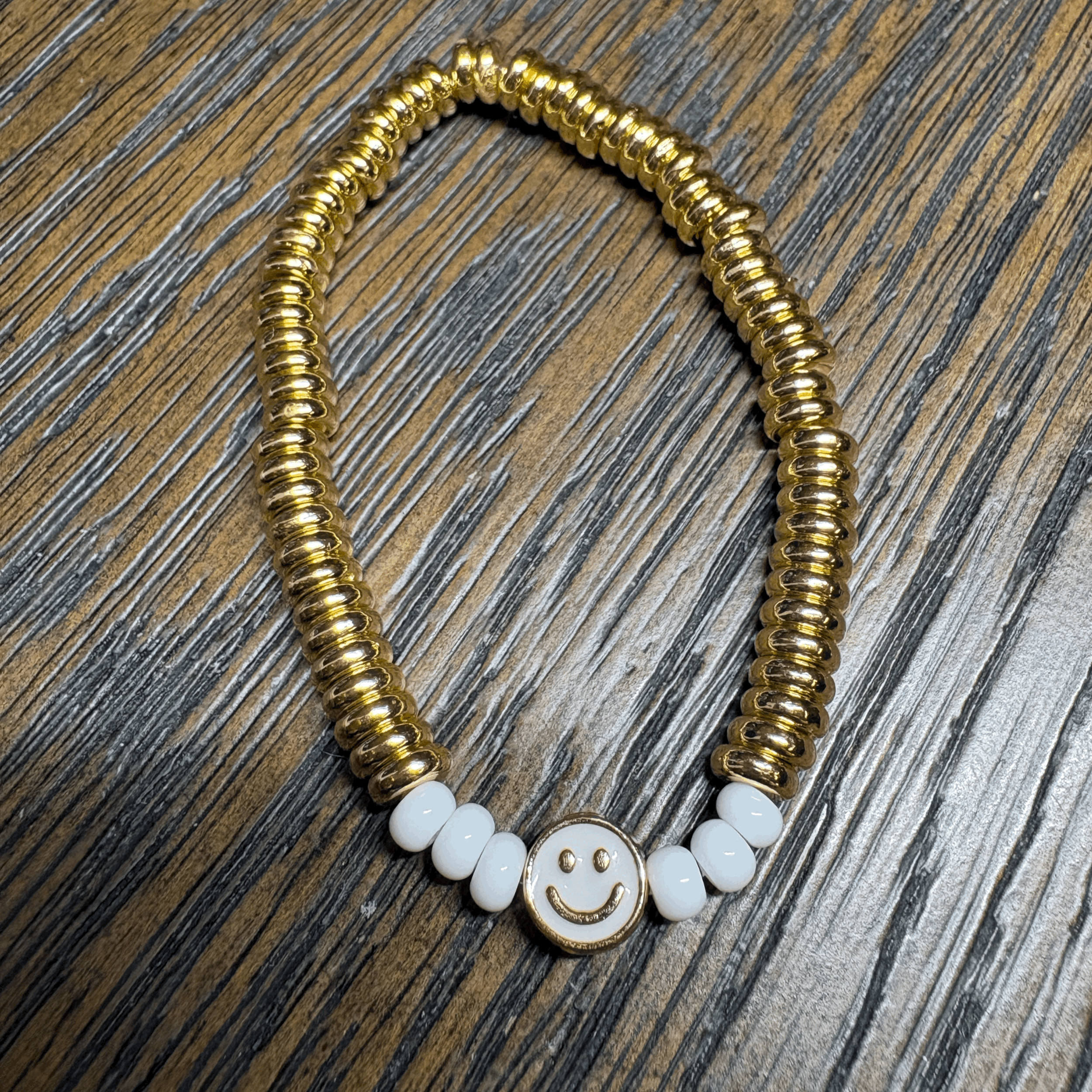 Gold sweetie bracelet with white beads