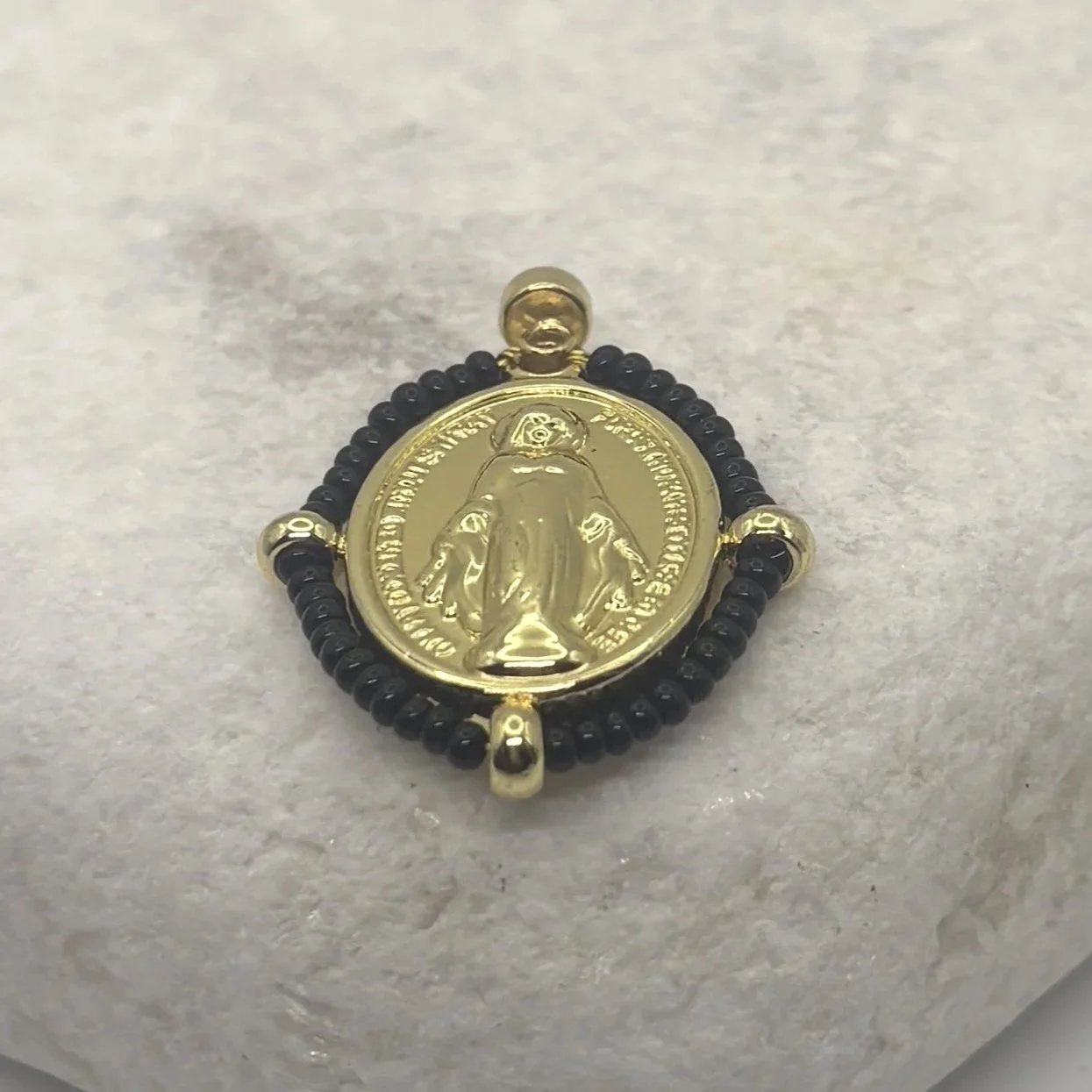 Oval 18K gold plated Virgin Mary charm with a black bead surround