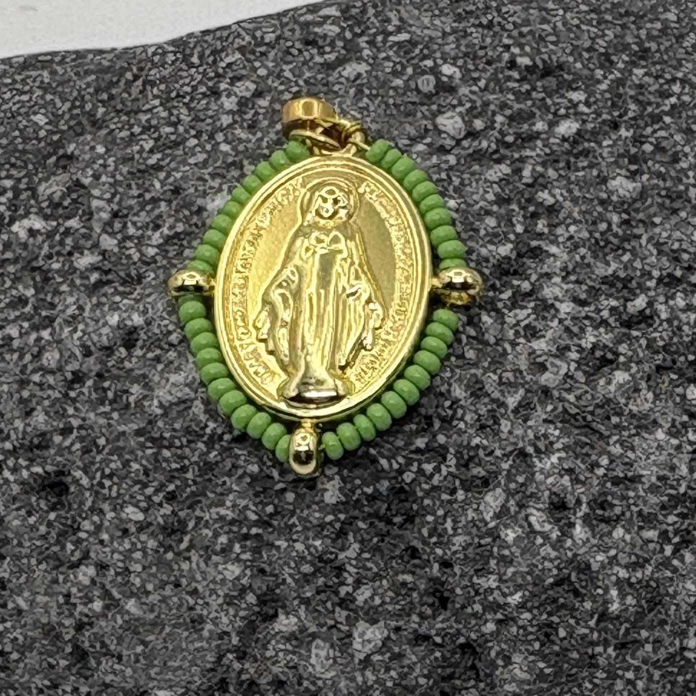 Oval 18K gold plated Virgin Mary charm with a bud green bead surround