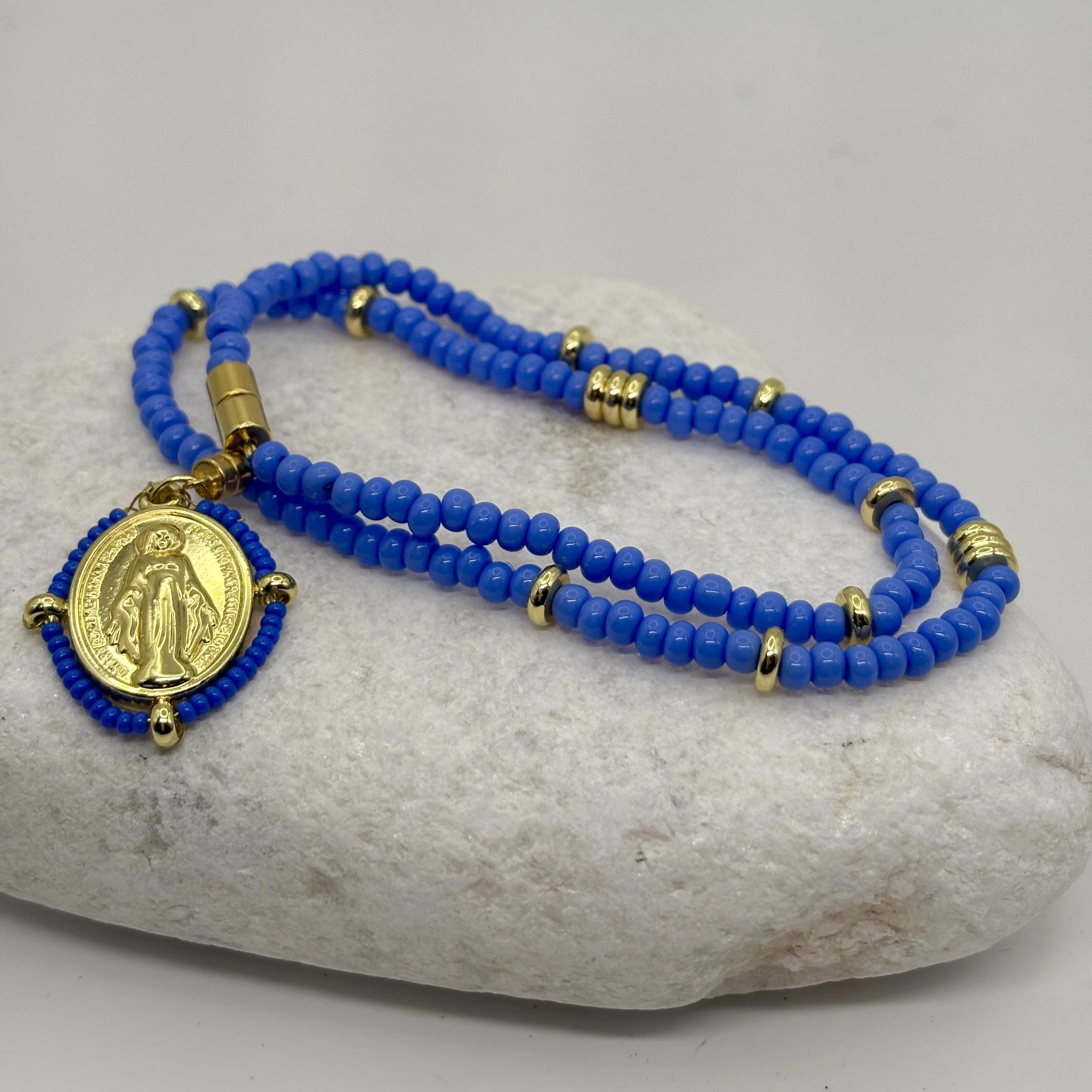 Pale blue and gold necklace