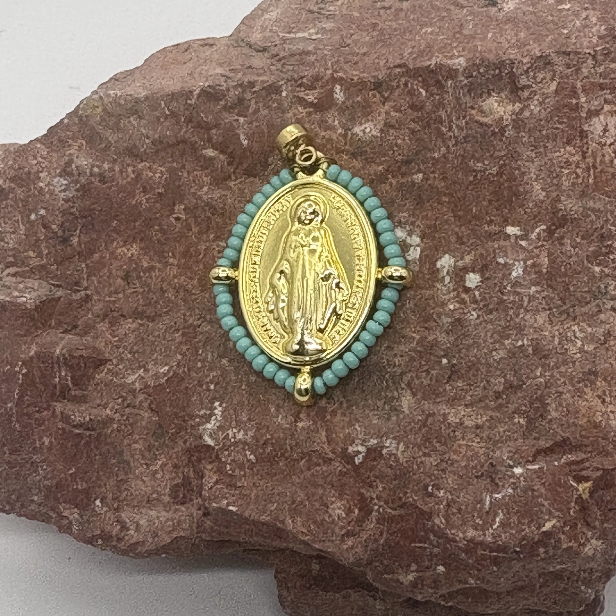 Oval 18K gold plated Virgin Mary charm with a turquoise bead surround