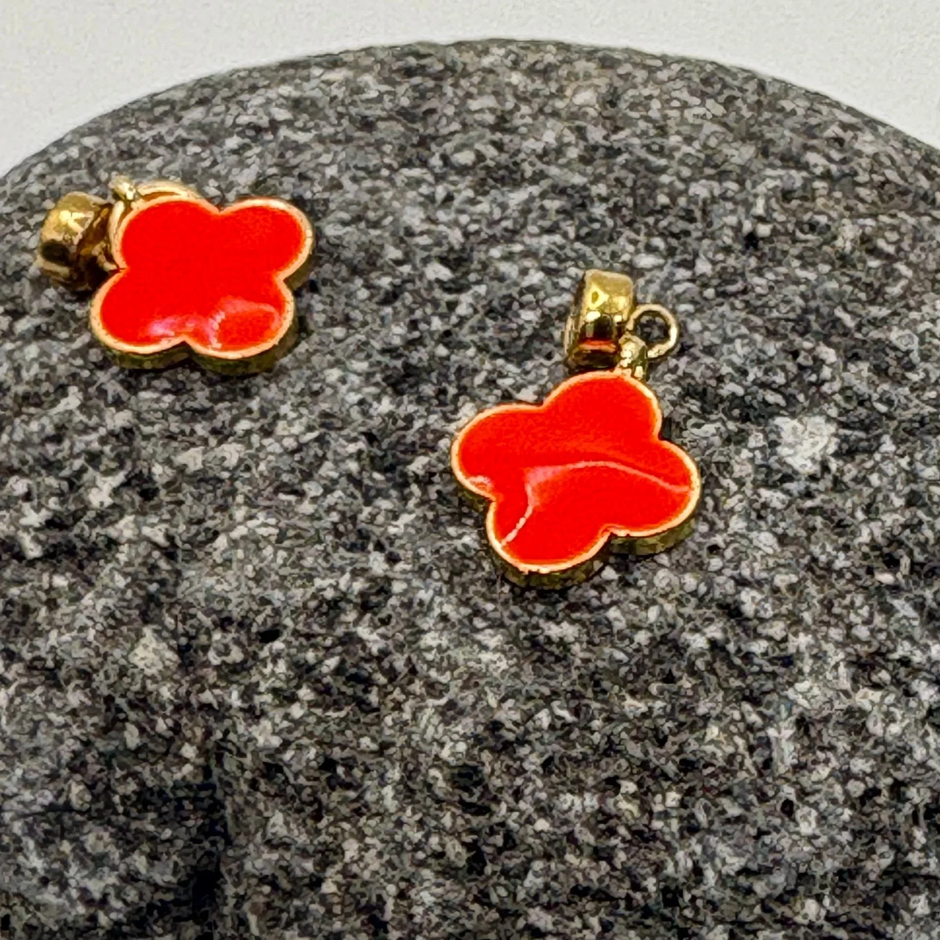 Red enamel and gold clover charm