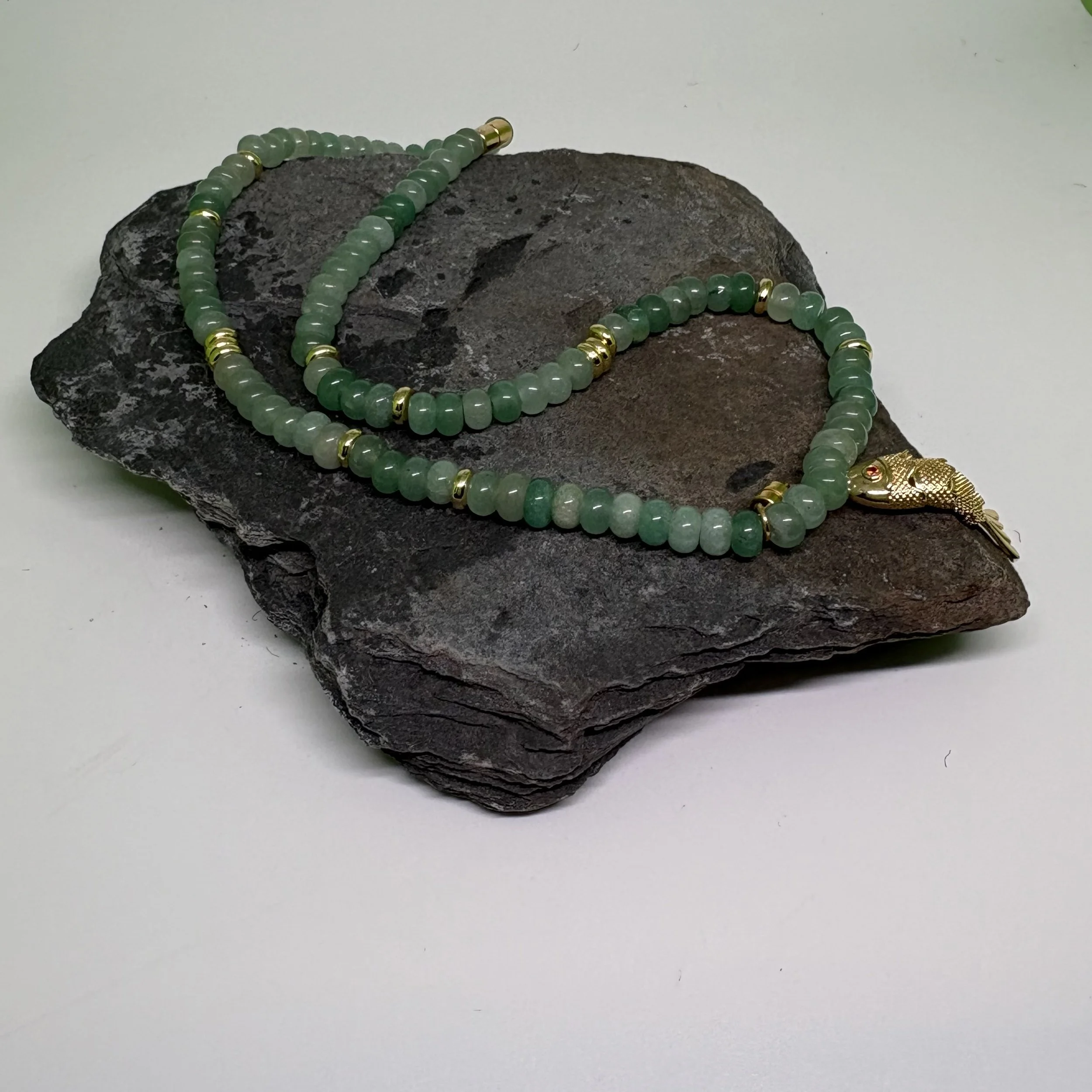 Frosted green glass and gold necklace with larger beads