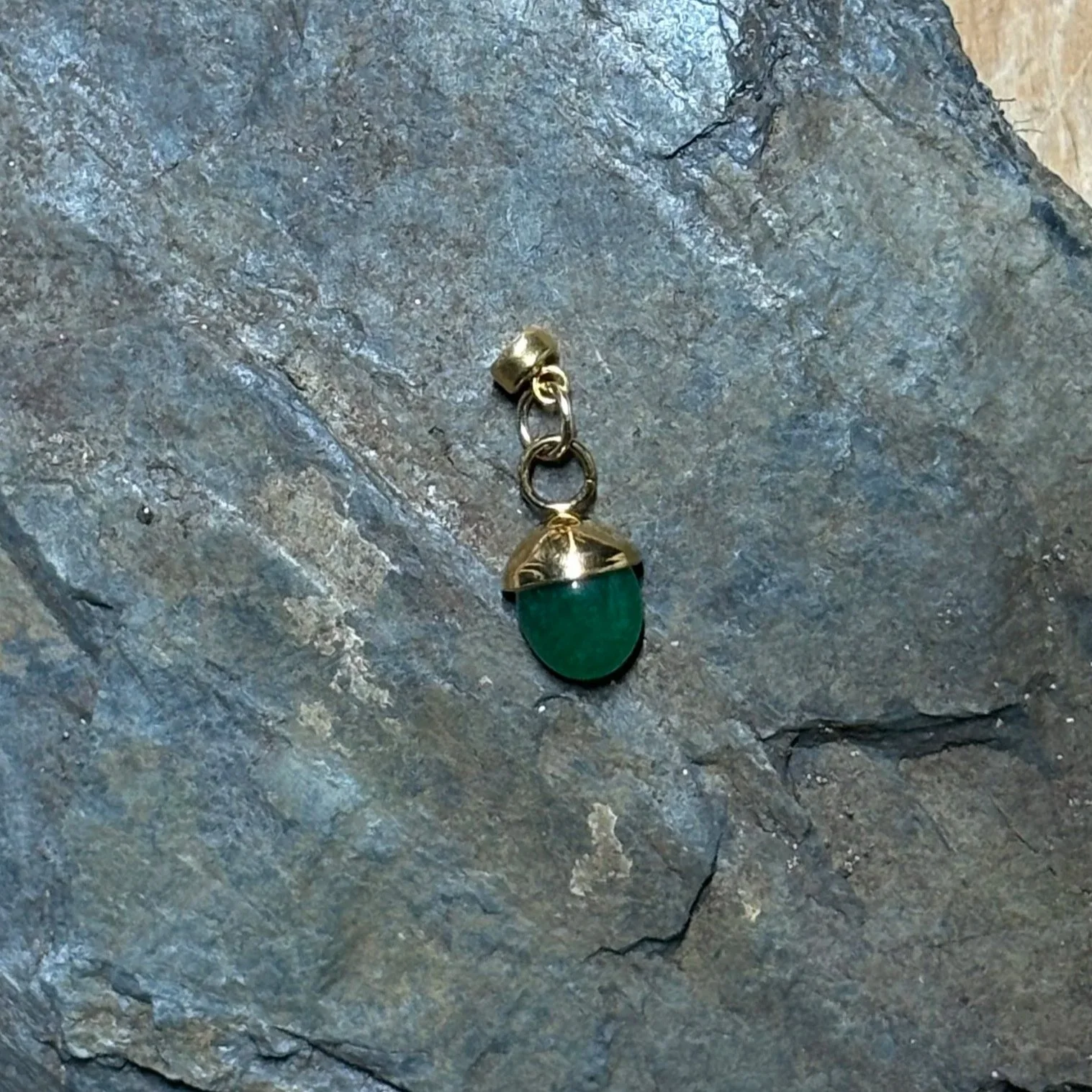 Green acorn stone charm