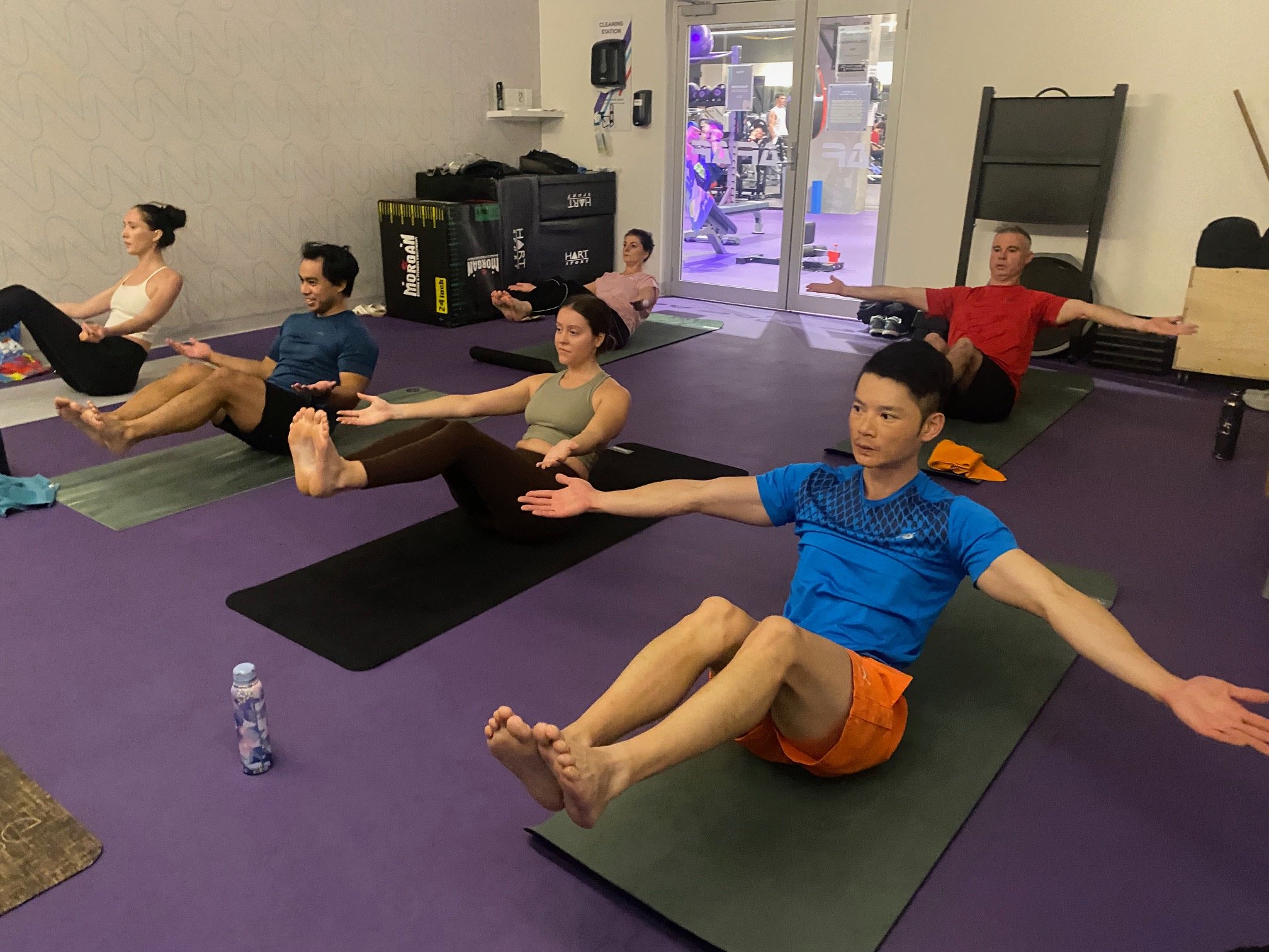 Grace guiding into High Boat - building core strength together at Anytime Fitness Milton