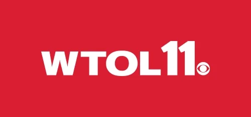 WTOL 11 CBS television station logo on a red background.
