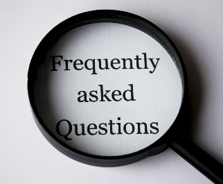 Magnifying glass focusing on the words 'Frequently asked Questions'