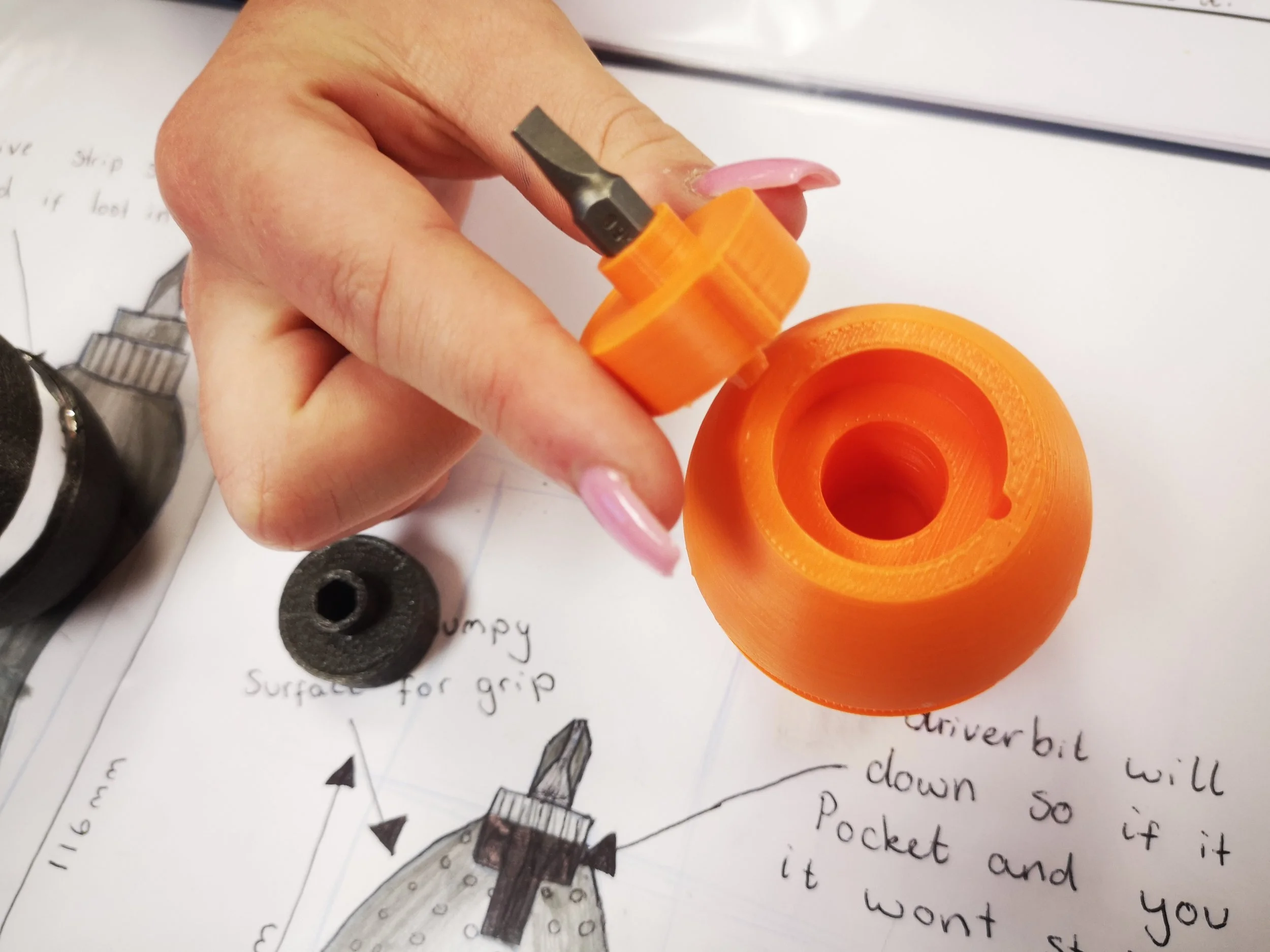 A girl's hand, holding a 3D printed screw-driver concept. 
