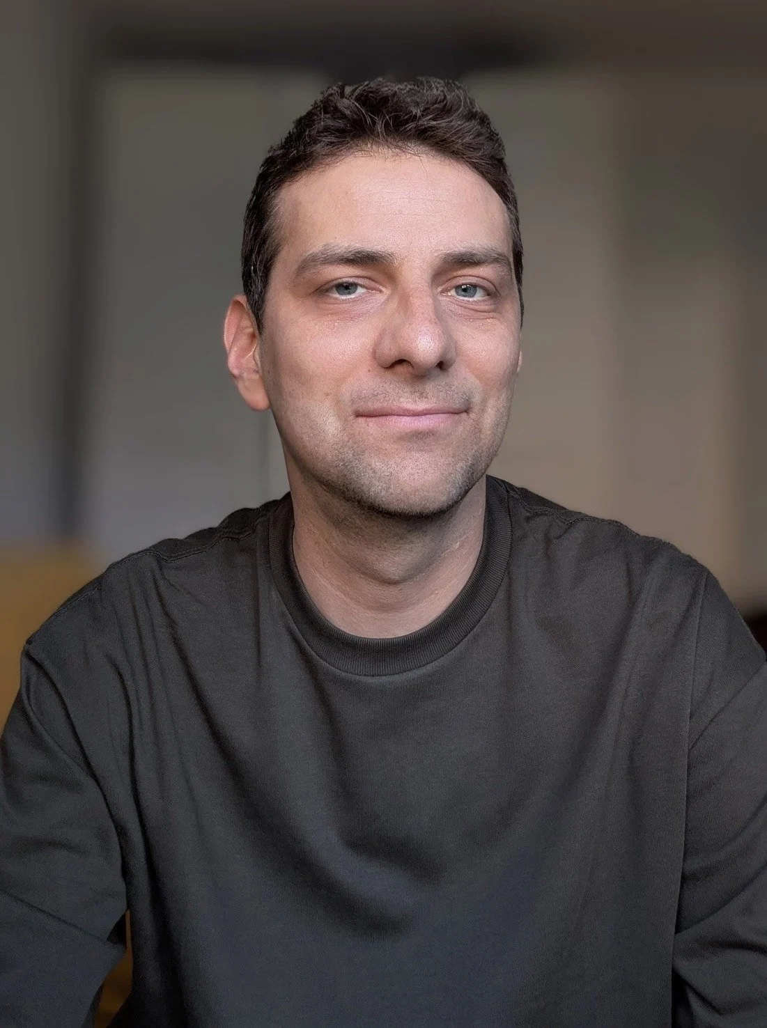Portrait of Albert Sobilo, integrative counsellor, seated indoors in natural light.