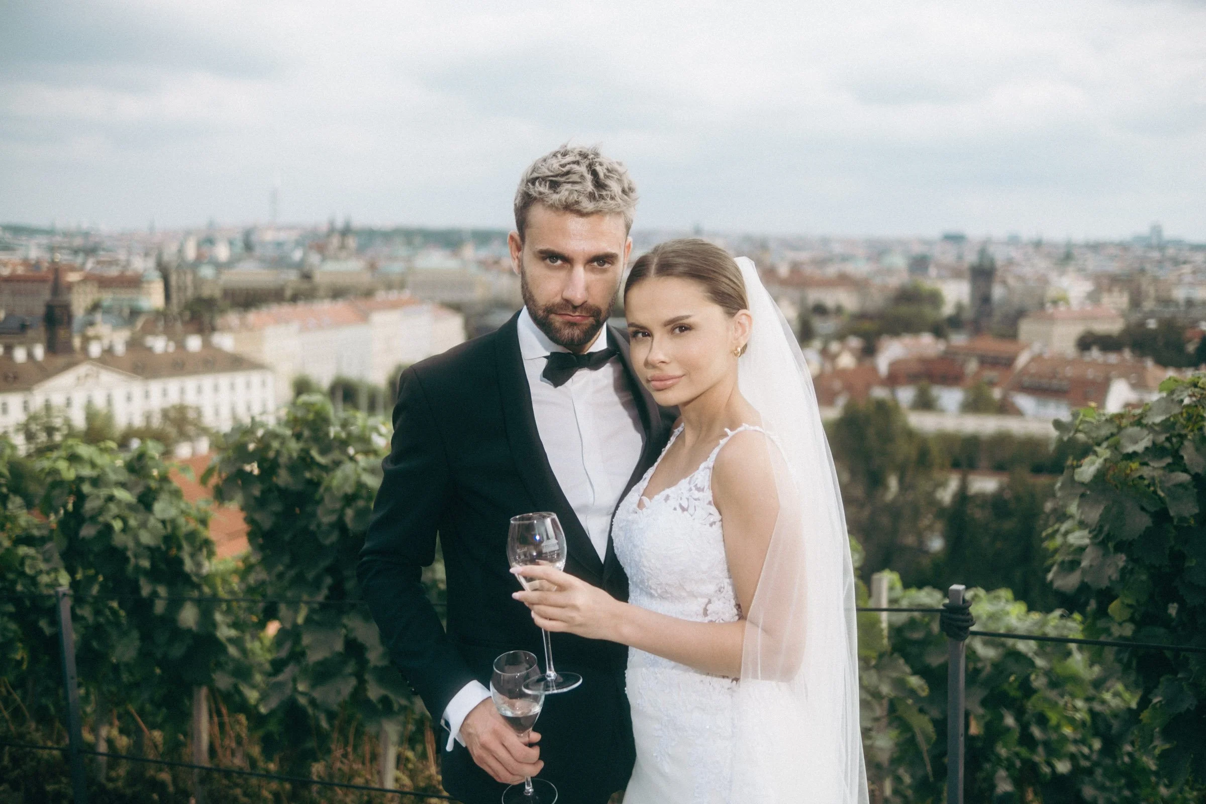 Editorial-style wedding portrait of a couple in Prague Old Town