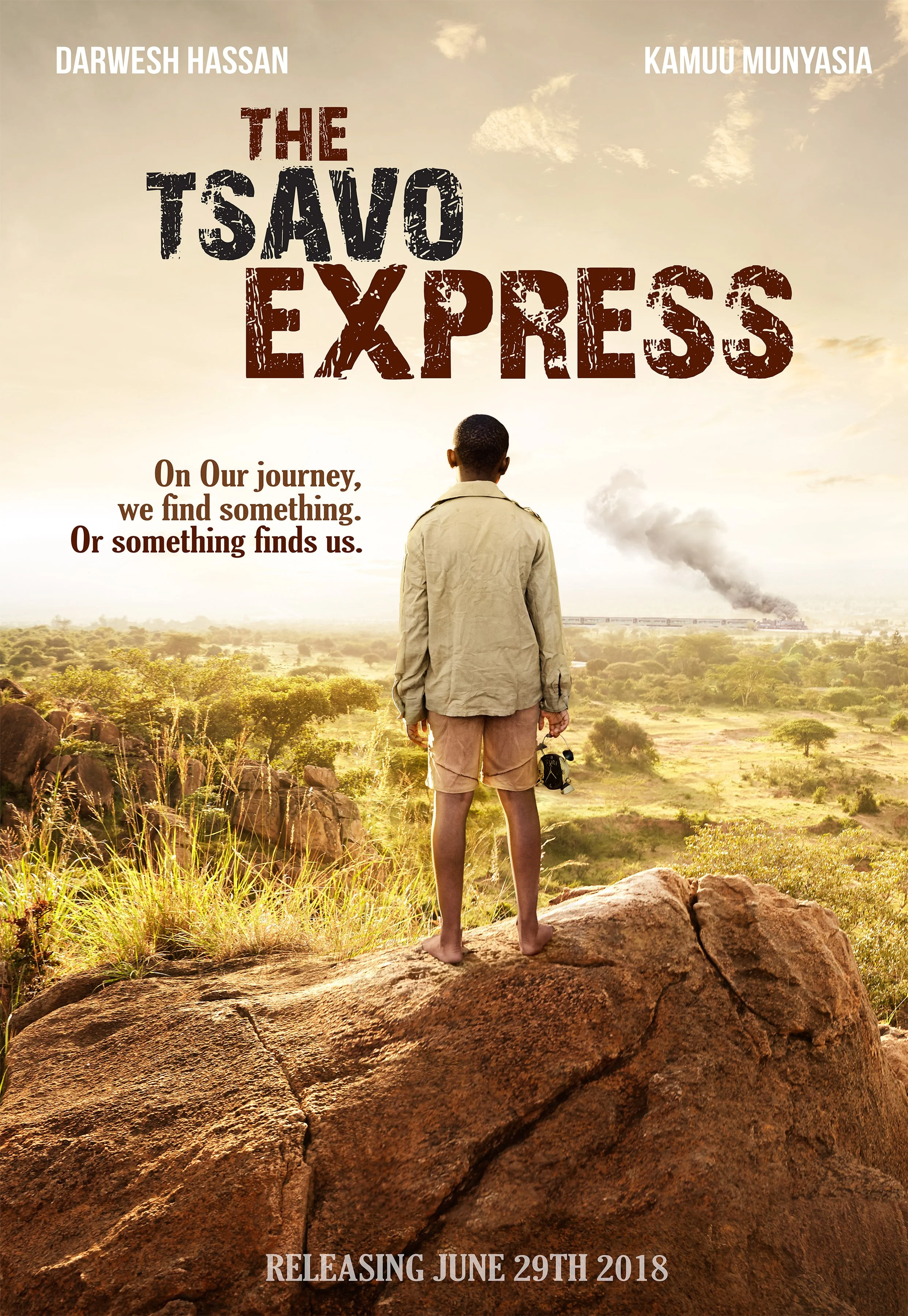 Movie poster for 'The Tsavo Express' featuring a man in an Africa safari setting, standing barefoot on rocks, with a train emitting smoke in the background and a cloudy sky, text indicating the lead actors Darwesh Hassan and Kamuu Munyasia, and the release date June 29th, 2018.