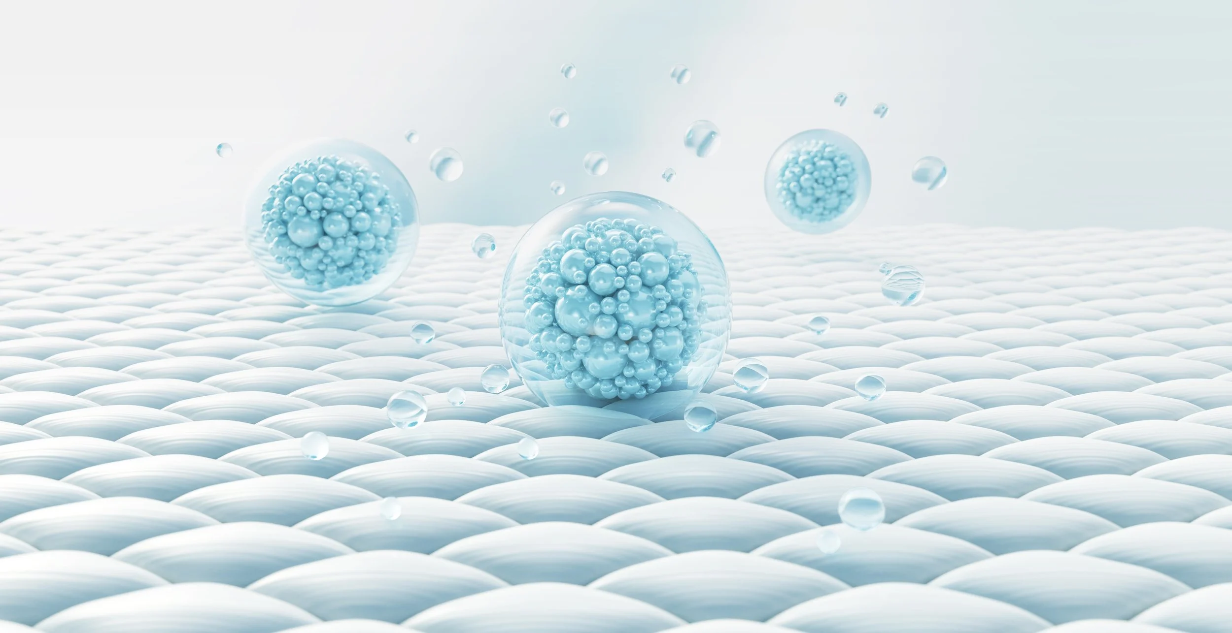 Multiple transparent spheres containing clusters of smaller blue spheres, floating above a textured white surface.