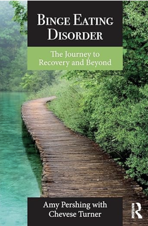 Book cover titled "Binge Eating Disorder: The Journey to Recovery and Beyond," authored by Amy Pershing with Chevesse Turner, features a pathway along a body of water surrounded by lush green trees.