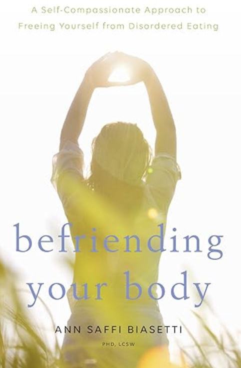 Book cover for "befriending your body" featuring a woman stretching with arms raised, backlit by sunlight, in an outdoor setting with tall grass.