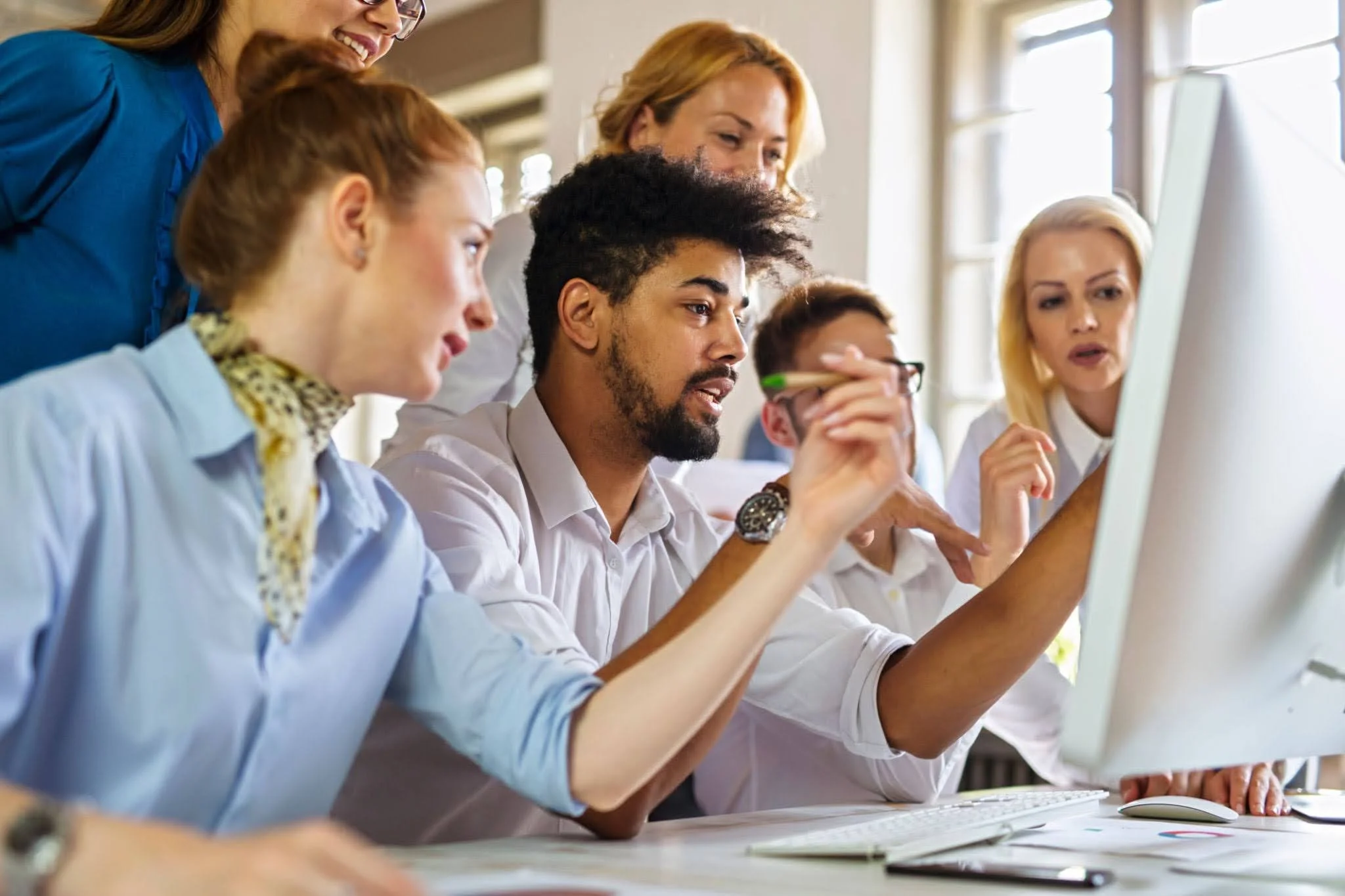 Team looking at screen