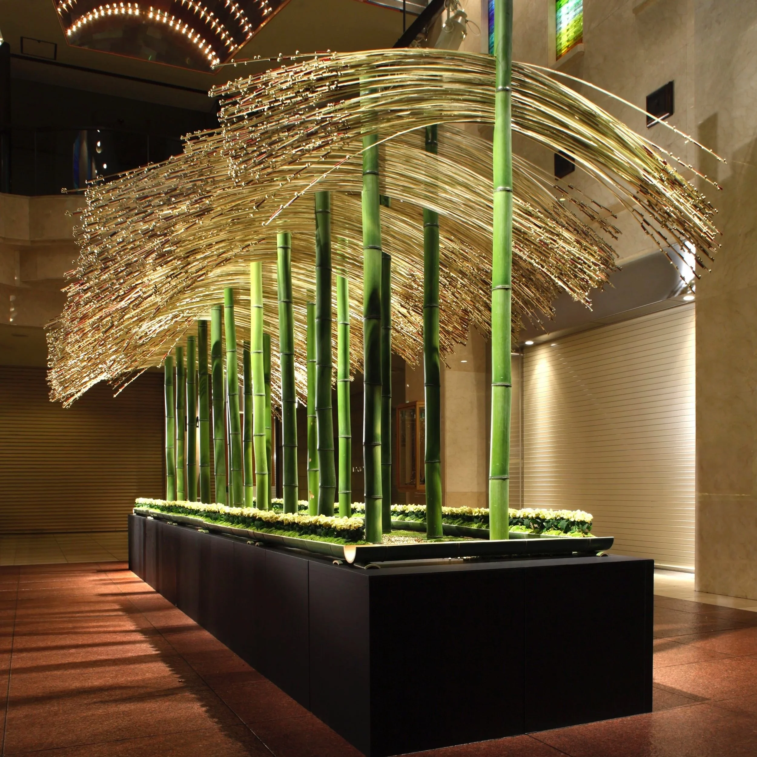 Daniel Ost bamboo and willow sculptural floral installation in modern interior.