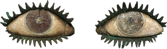 A pair of eyes with spiky eyelash-like features surrounding them, resembling a creature or artistic design.