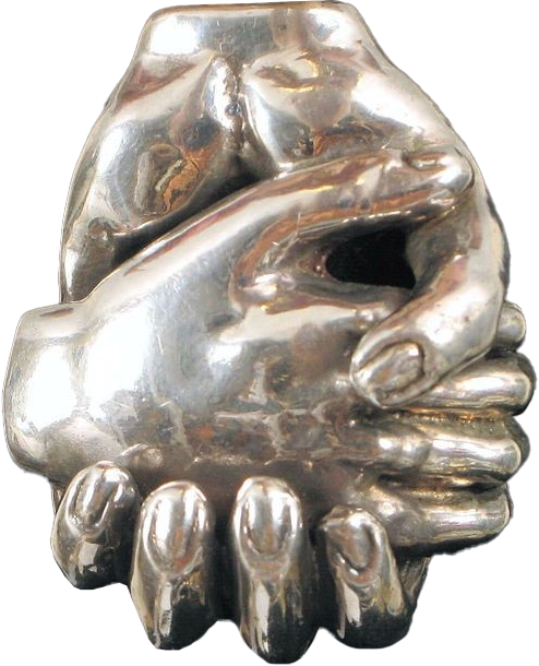 A silver sculpture of two hands gripping each other tightly, symbolizing unity or support.