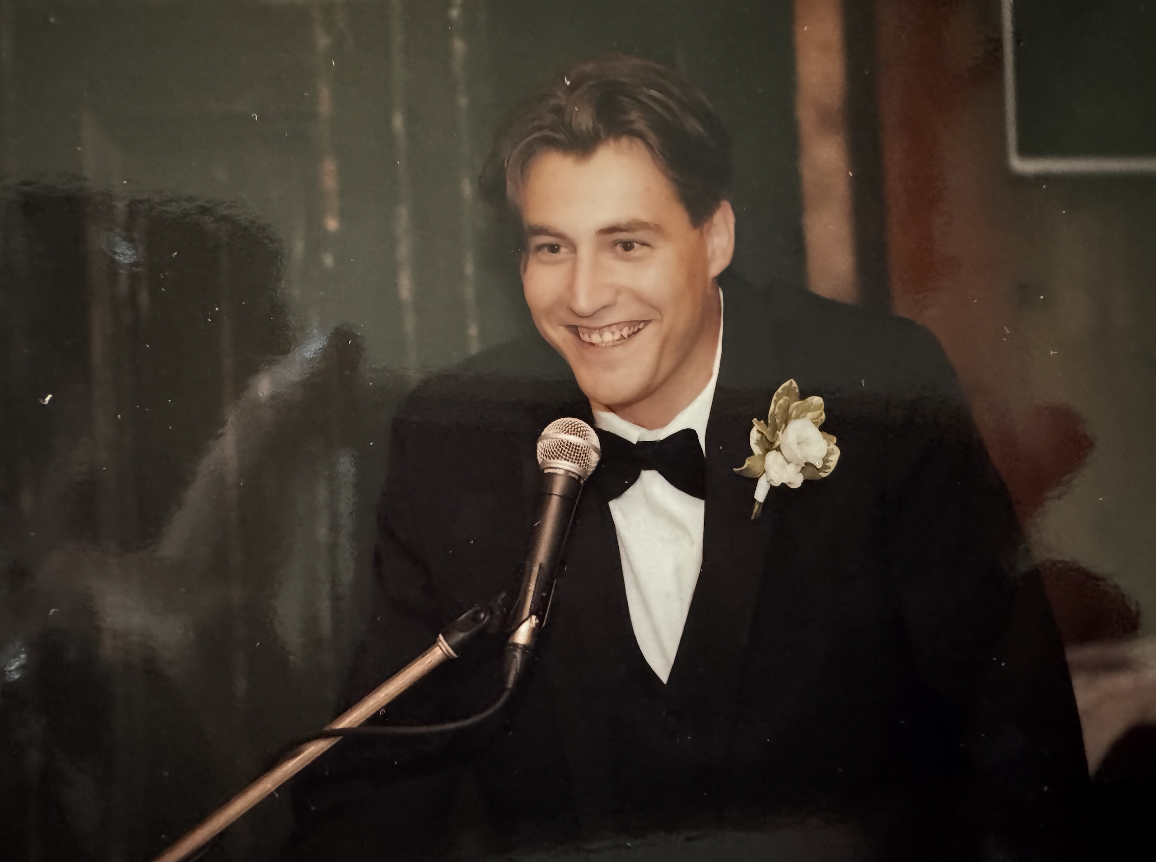 John MacLean speaking at a wedding.