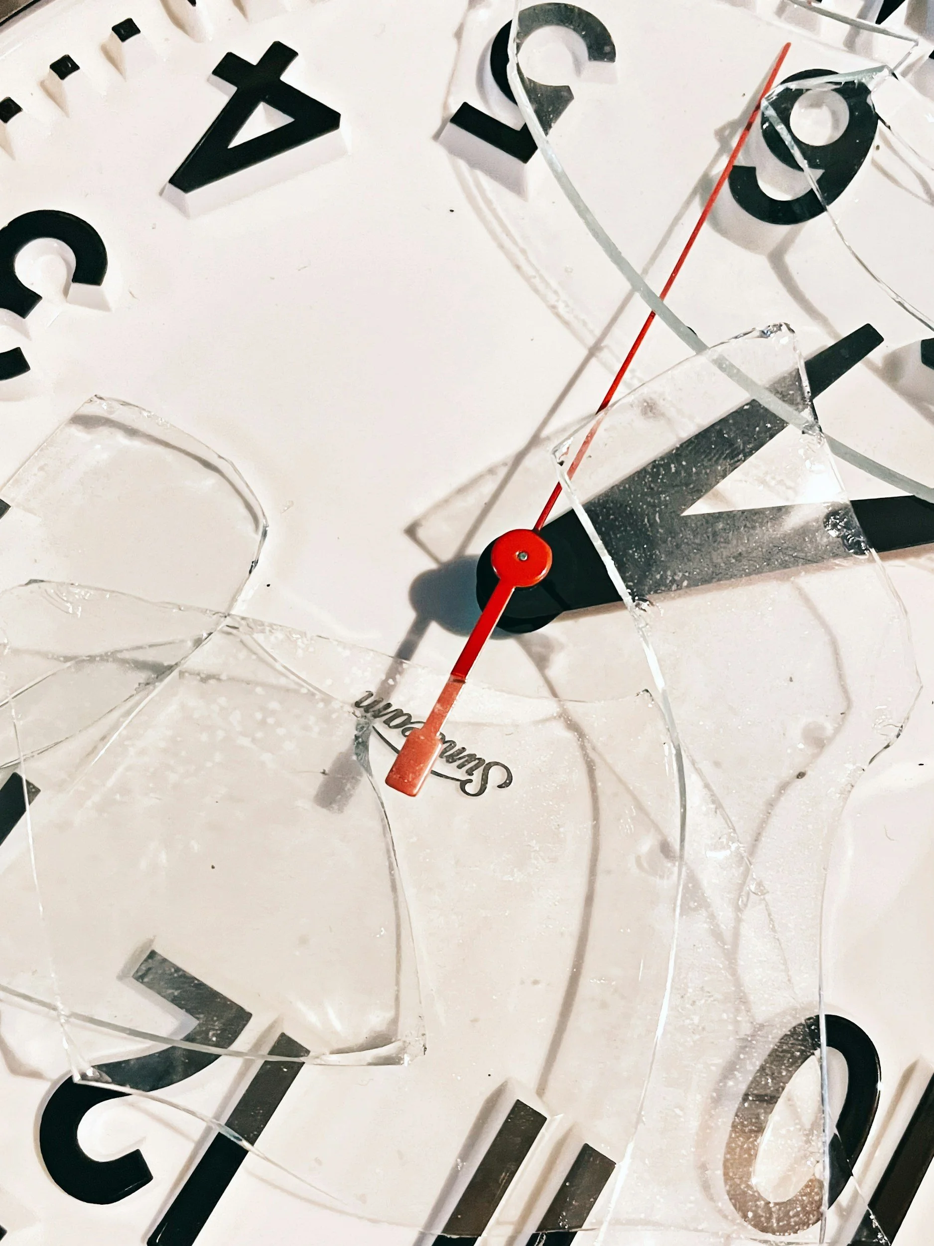Close-up image of an clock with a broken glass cover, representing the idea that you're not behind when writing your novel and to ignore the clock