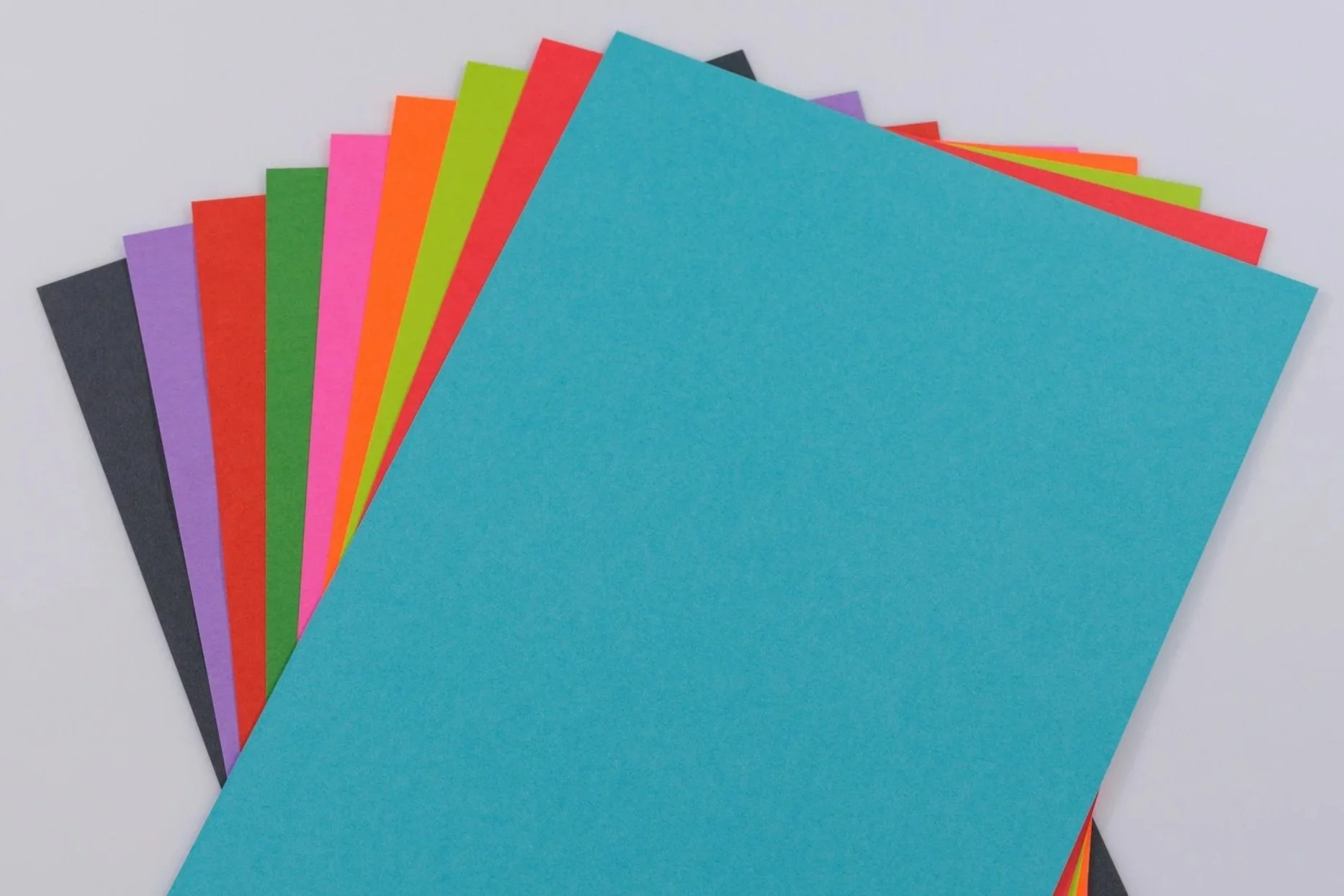 Stack of colorful folders fanning out to illustrate organization